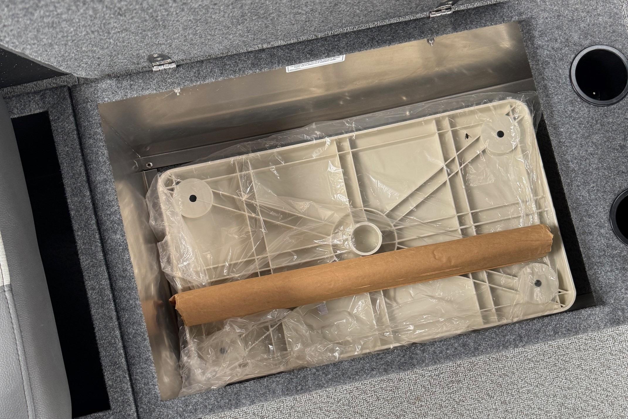 Storage compartment in 2024 Spartan 26 Maximus Pro XL, featuring organized interior space.