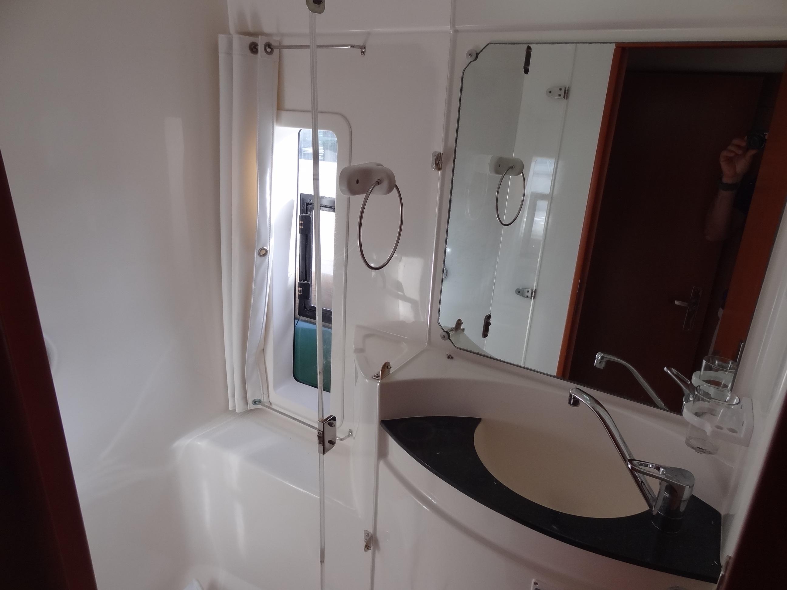 2014 Leopard 58 yacht bathroom with modern fixtures and mirror.