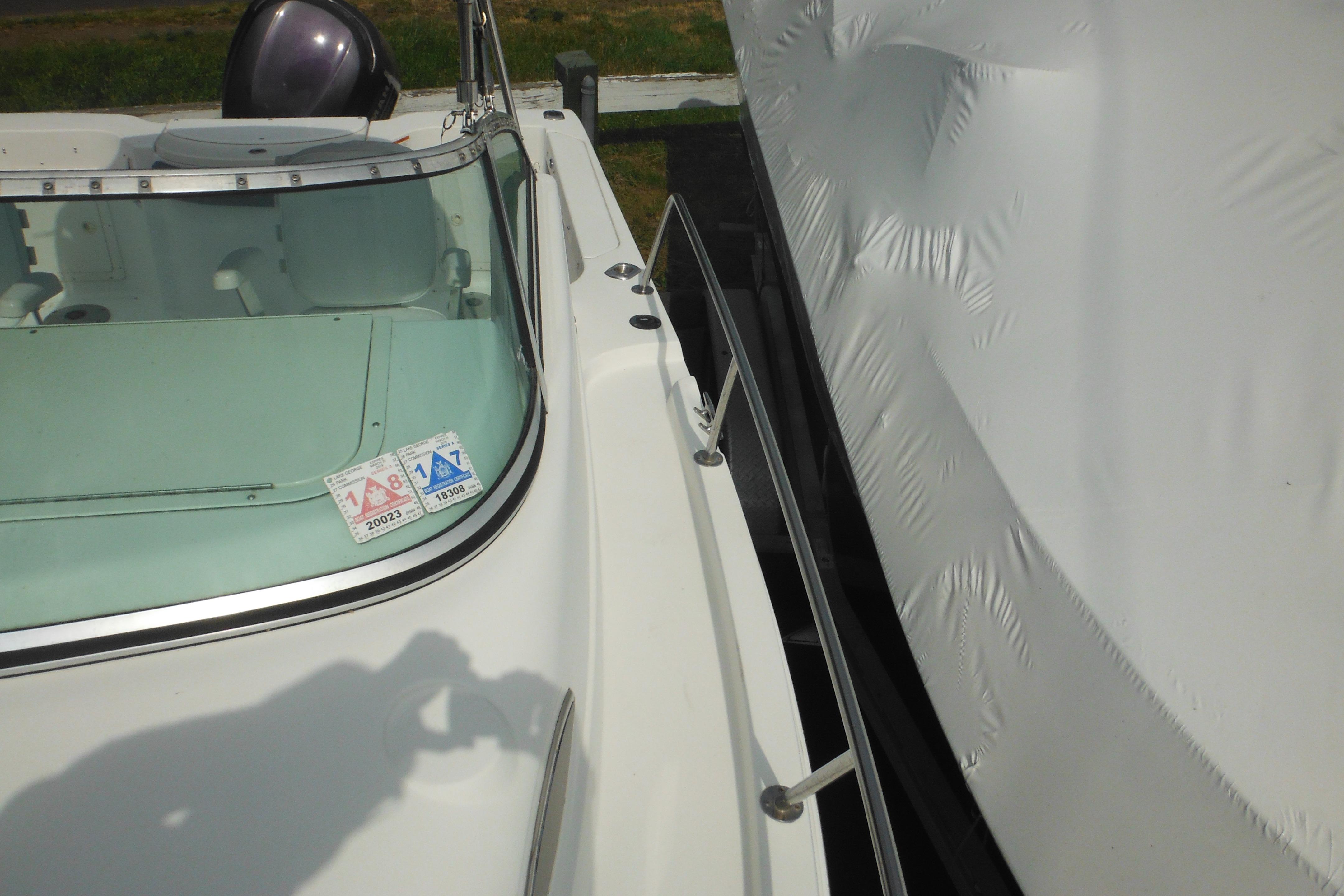2005 Seaswirl Striper 2101 Walkaround O/B boat with windshield and registration stickers.
