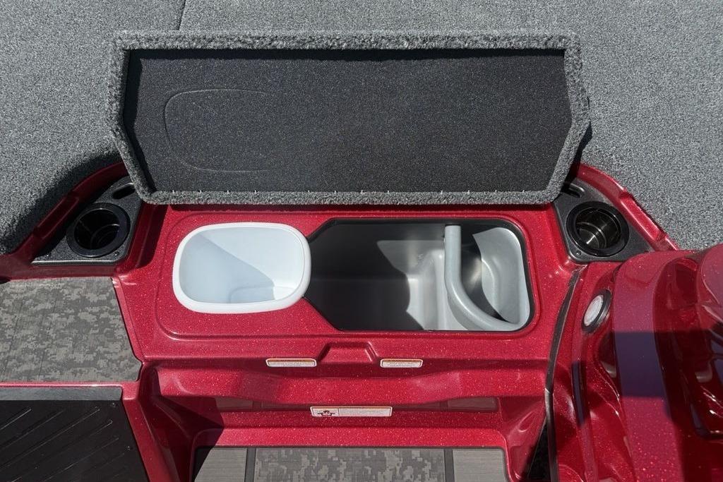 Open storage compartment in 2026 Nitro Z20 XL Pro boat, featuring cup holders and sleek design.