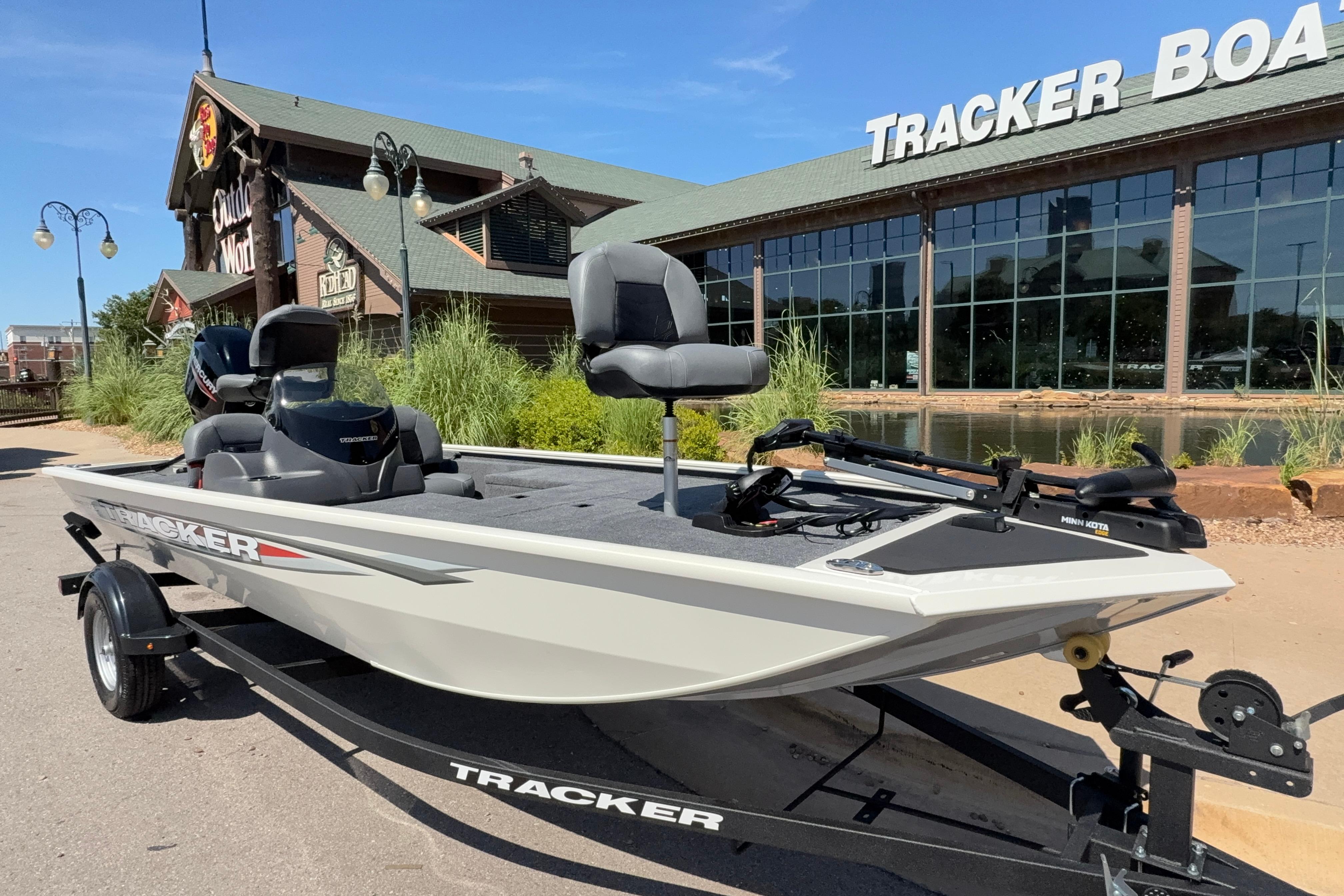 2026 Tracker Pro 170 boat on trailer outside Tracker Boats store.