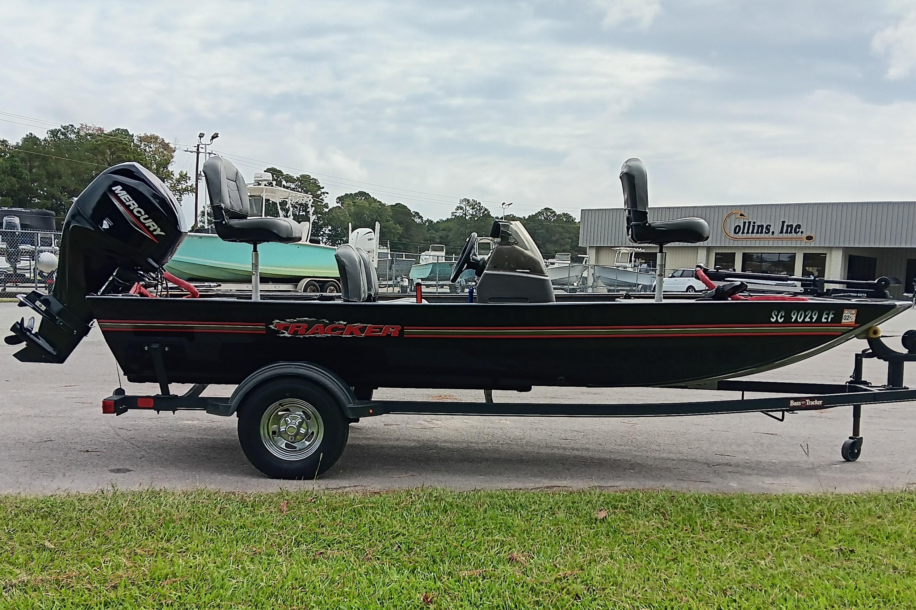 2023 Tracker Bass Tracker Classic XL boat on trailer, parked outdoors.