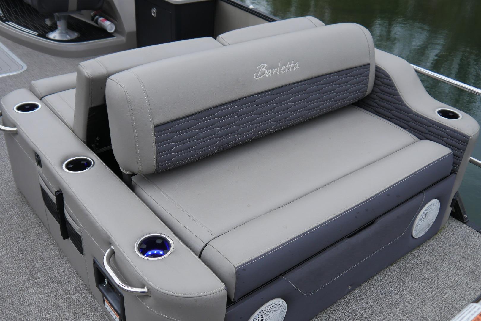 2023 Barletta CORSA 25UE boat seating with cup holders and elegant design.