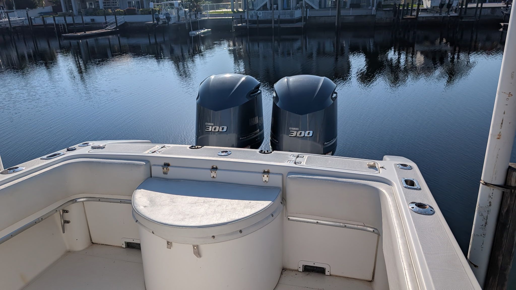 Fountain Center Console boat with twin outboard engines on calm water.