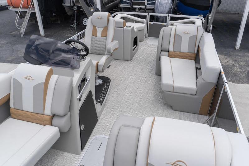 2026 SunCatcher Elite 326 SS pontoon boat interior with luxurious seating and modern helm.