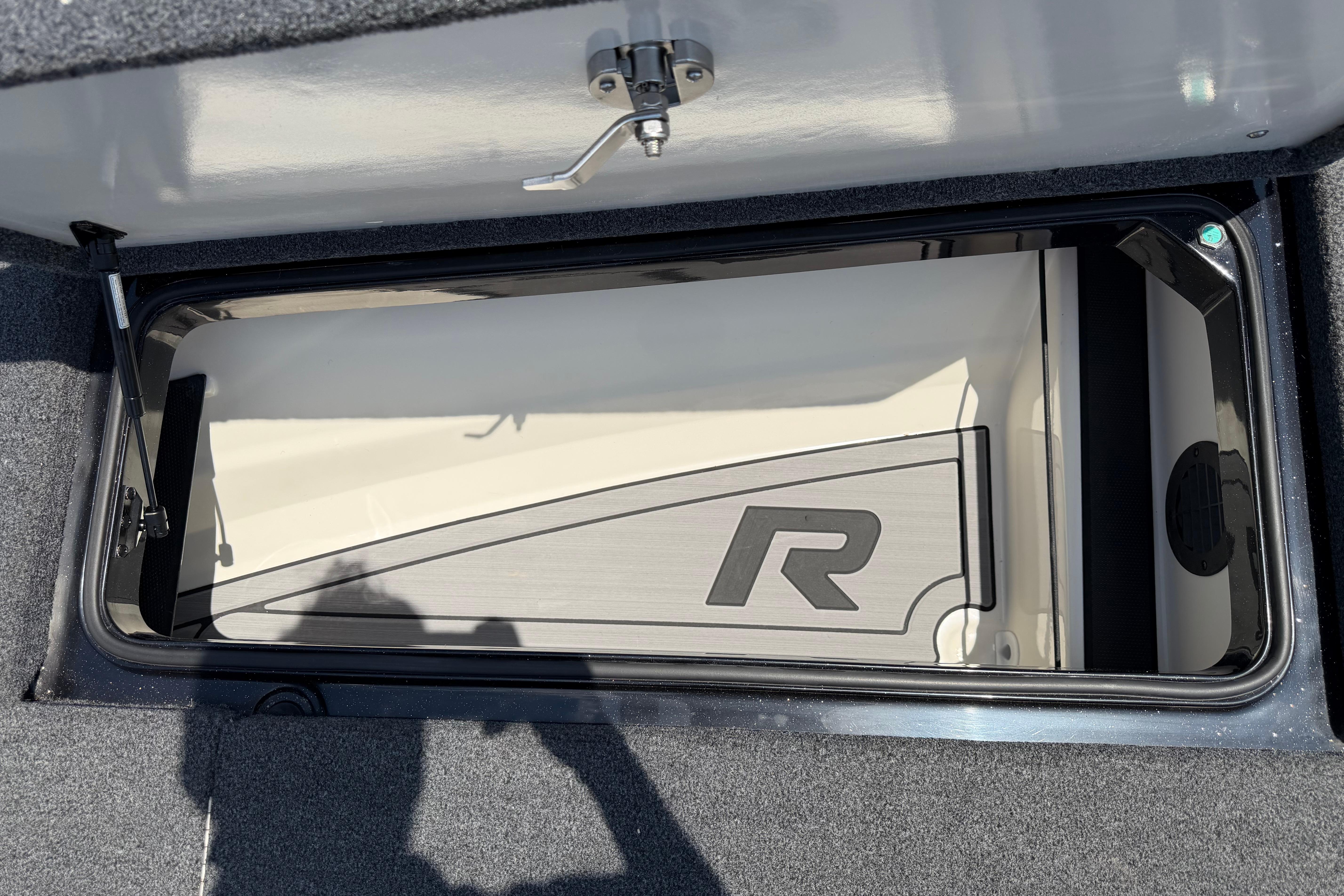 2023 Ranger Z520R storage compartment with open lid and logo detail.