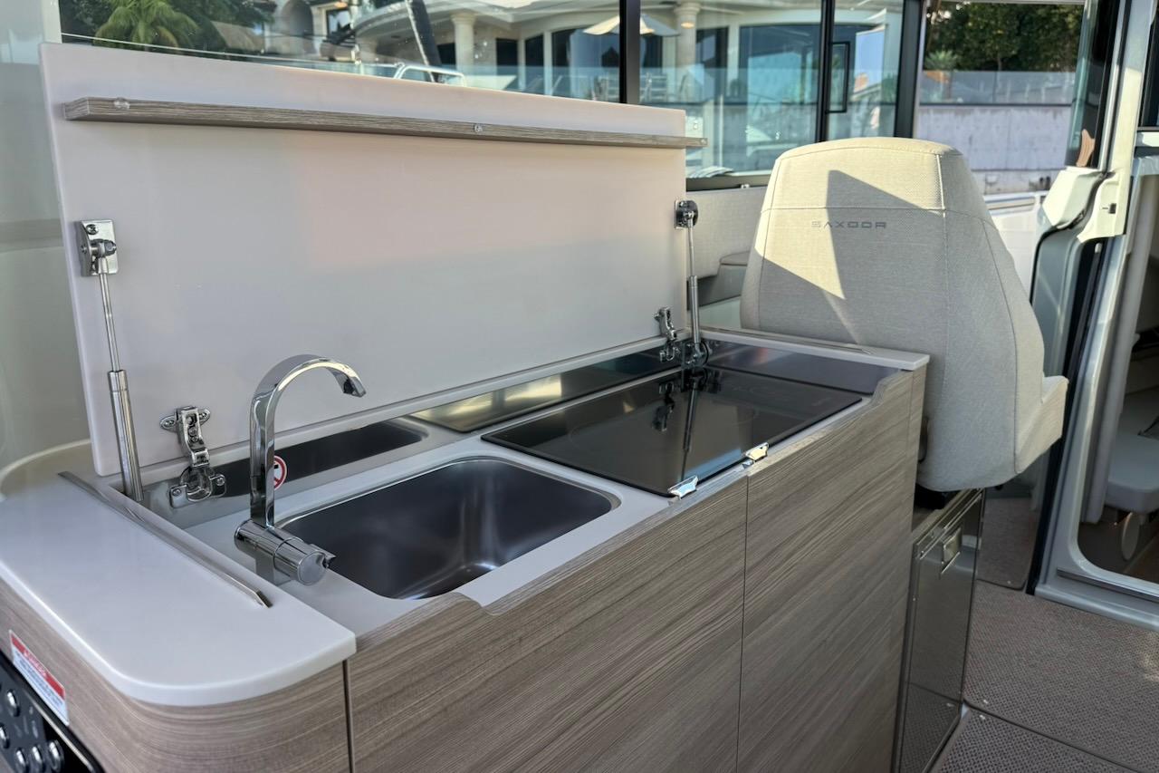 2024 Saxdor 320 GTC interior with modern kitchenette and sleek design.