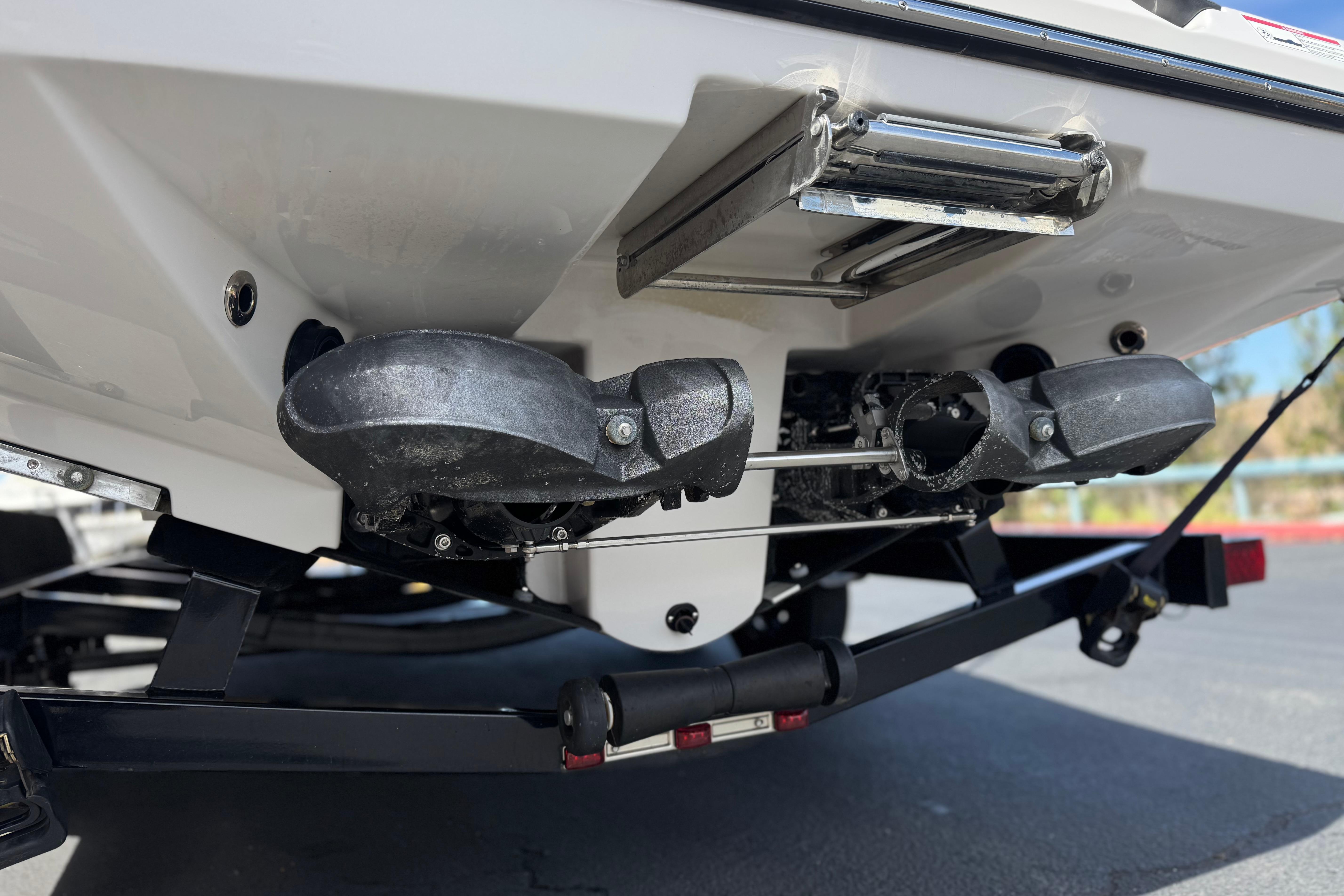 2017 Scarab 255 H.O. Platinum boat underside with trailer, showcasing propulsion system.