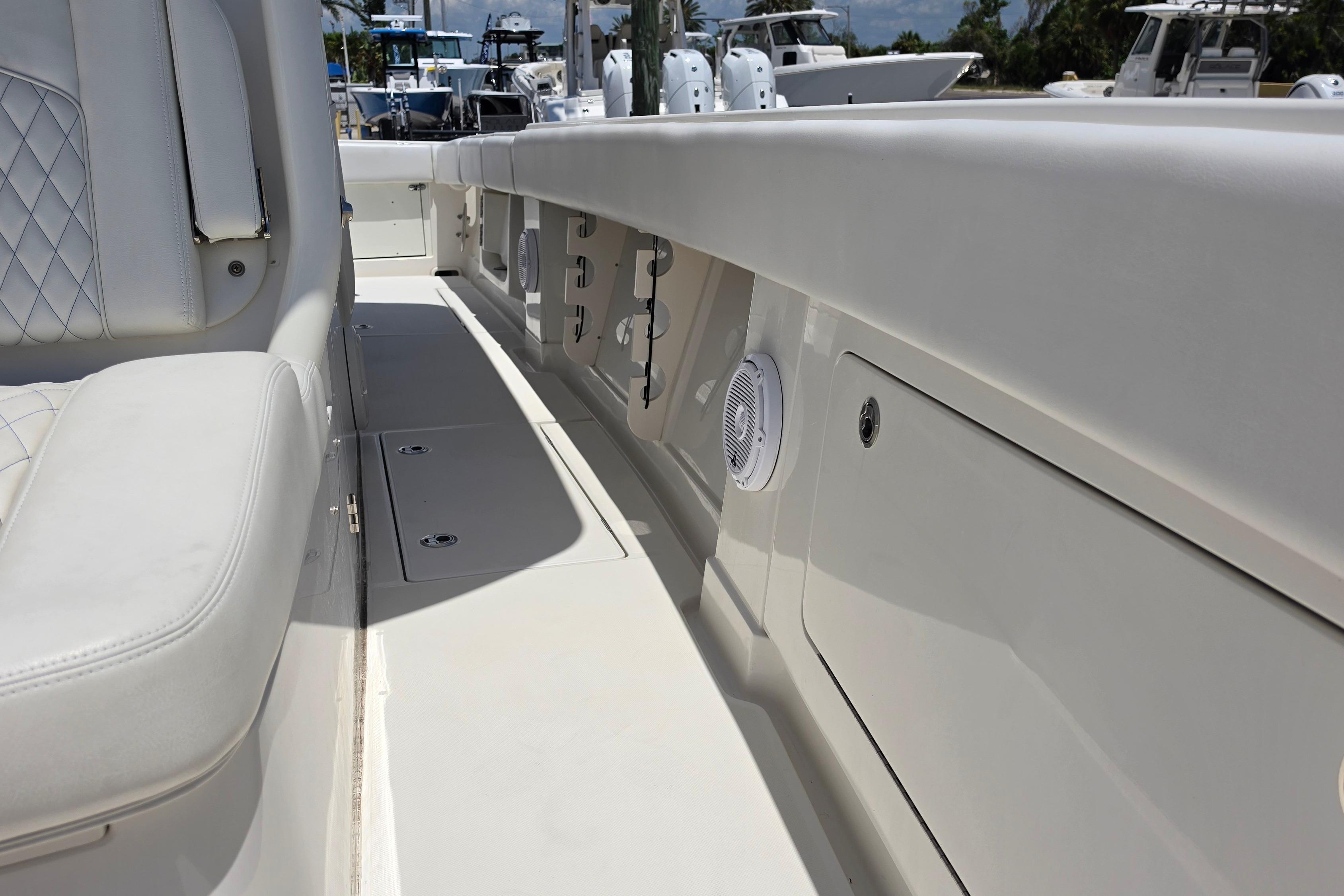 2020 Jupiter 34 HFS boat interior with white seating and storage compartments.