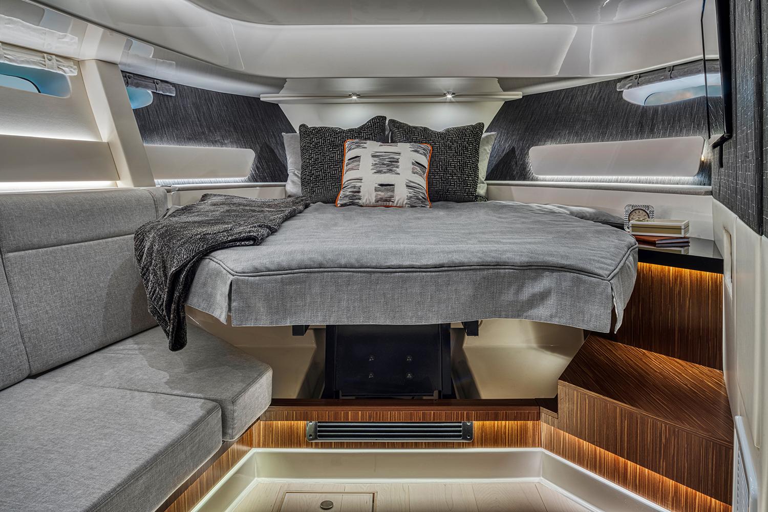 Manufacturer Provided Image: Luxurious cabin interior of 2023 Sea Ray Sundancer 370 OB with modern bedding and ambient lighting.