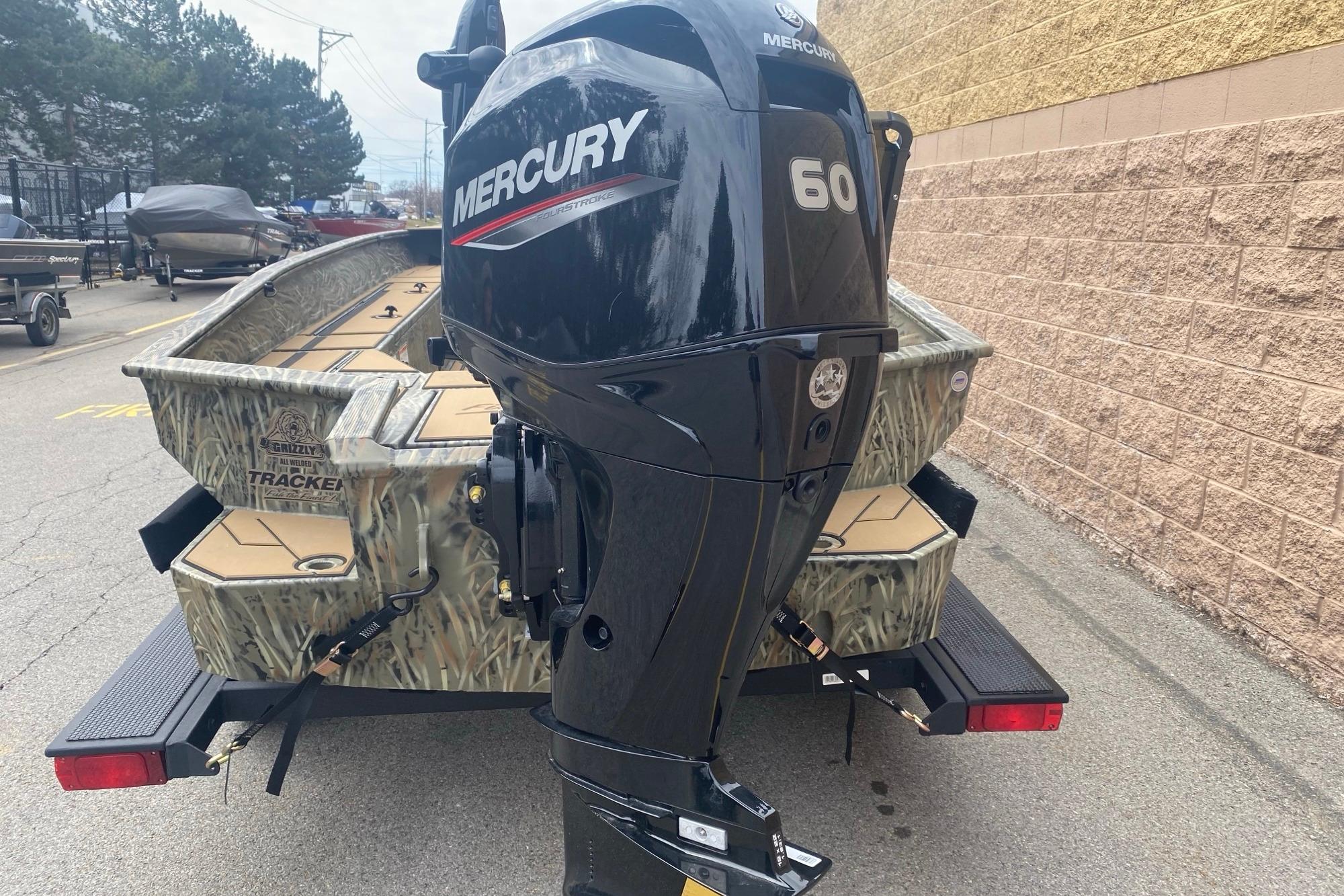 2026 Tracker Grizzly 1756 T Marsh boat with Mercury 60 outboard motor on trailer.