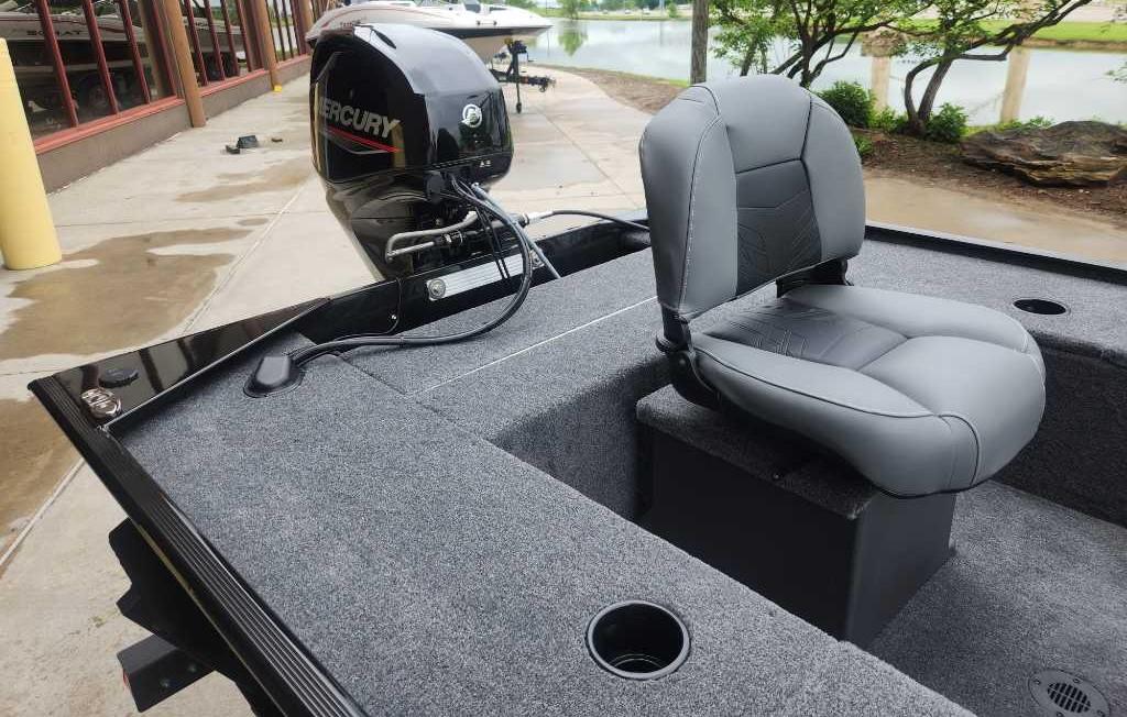 2025 Tracker Panfish 17 boat with Mercury engine, featuring a comfortable gray seat.