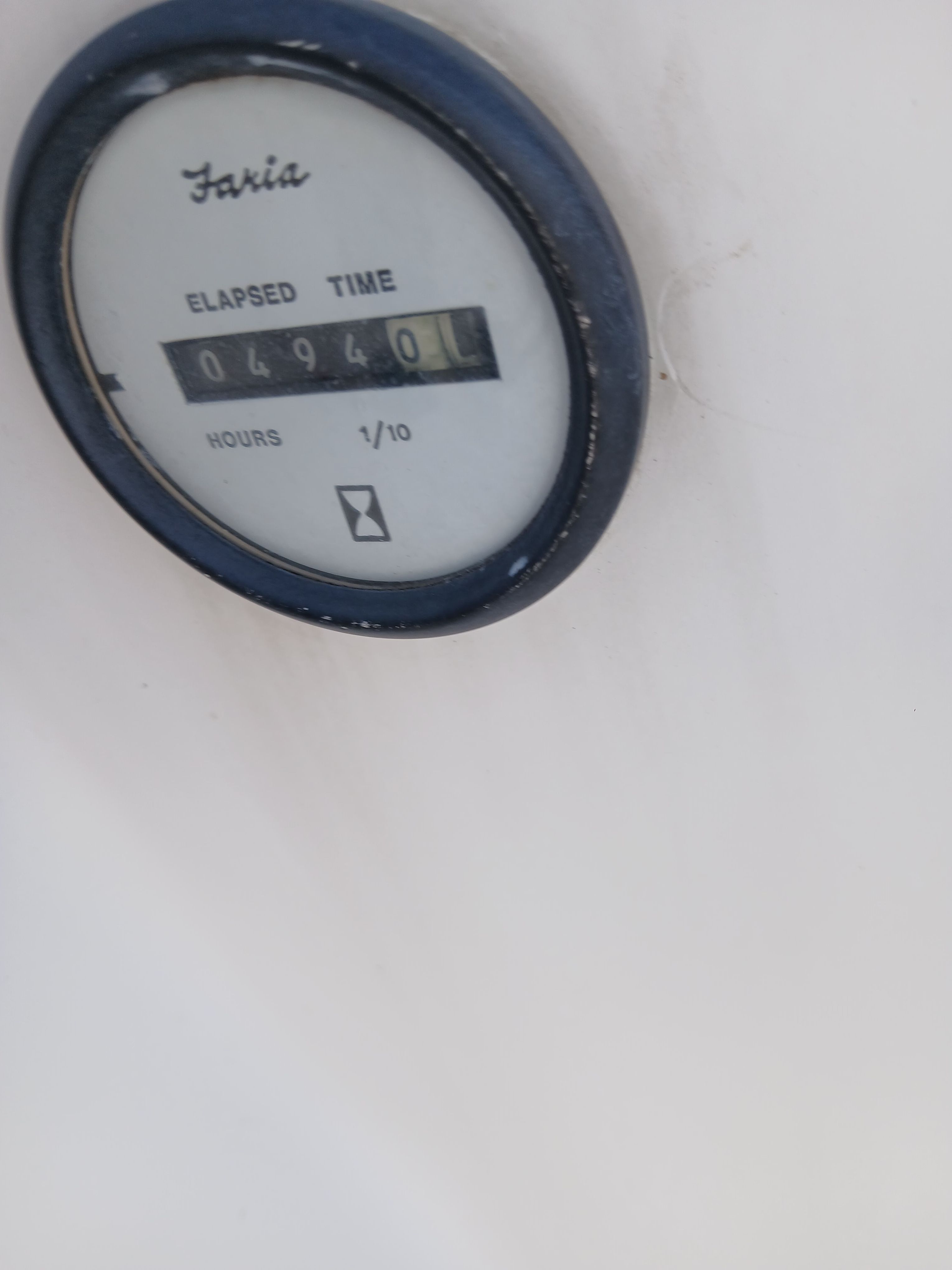 Hour meter on a boat showing 4940 hours.