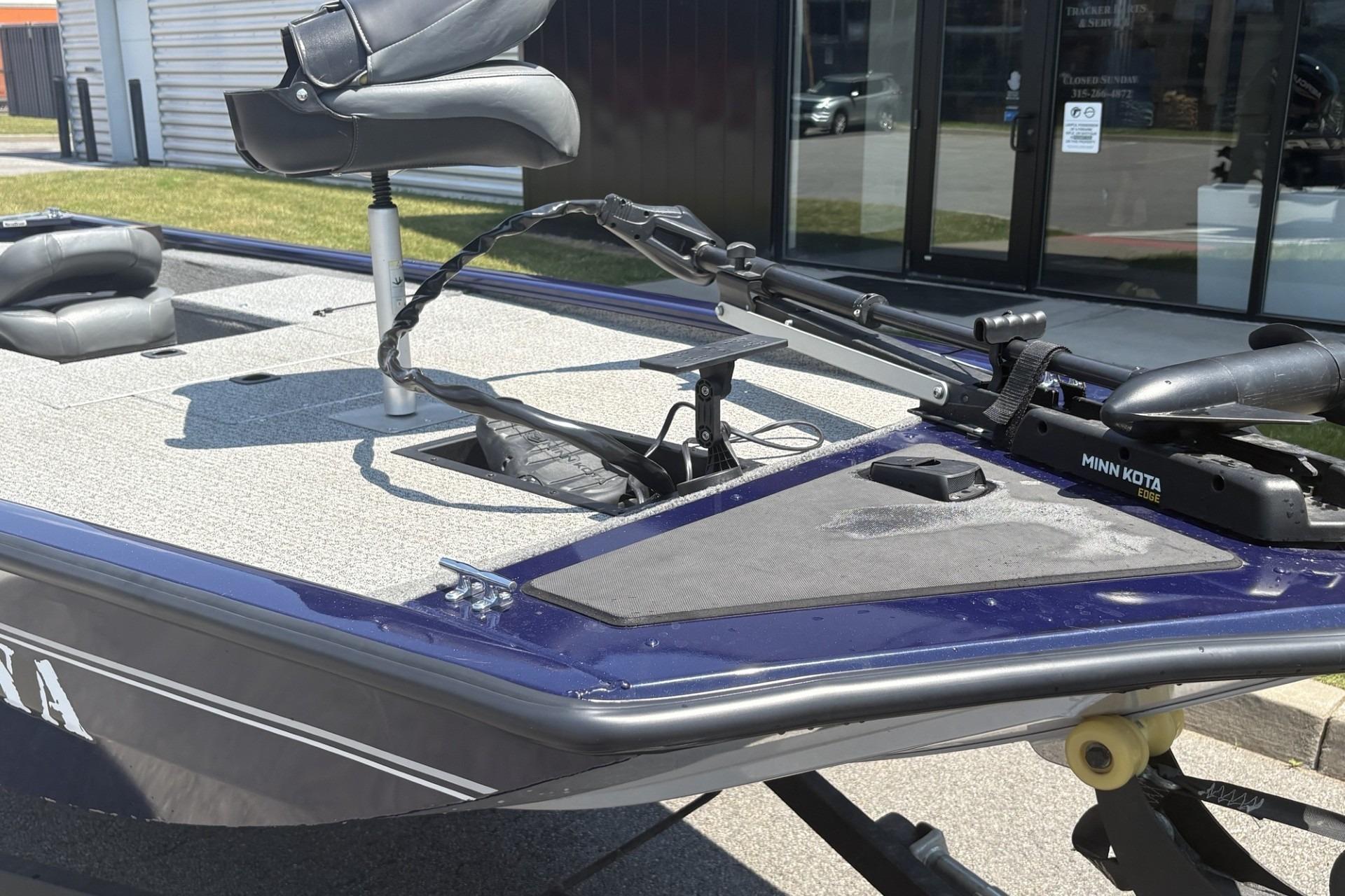 2020 Tracker Pro 170 boat with Minn Kota trolling motor, outdoor setting.