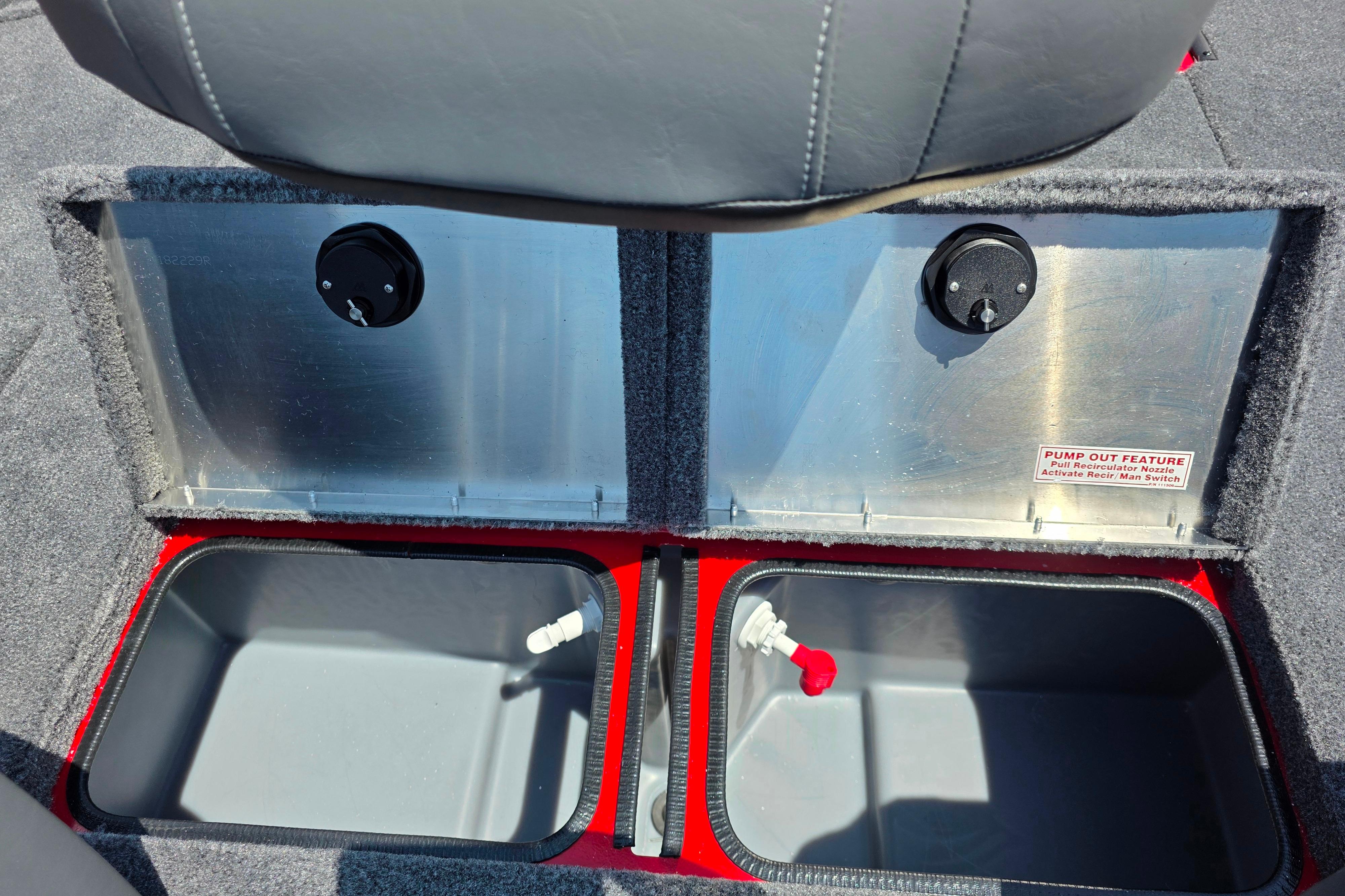 2026 Tracker Pro Team 195 boat storage compartments with pump-out feature and recirculation nozzles.