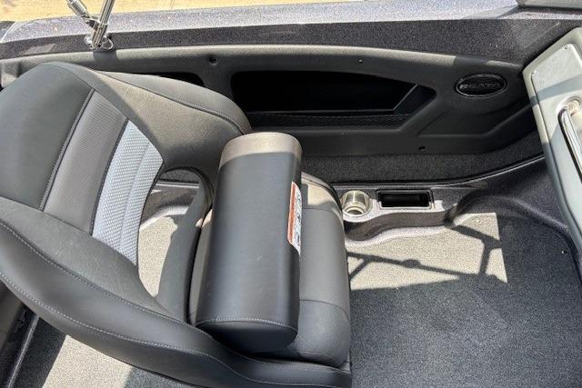 2026 Ranger 212LS boat interior with black seating and cup holder.