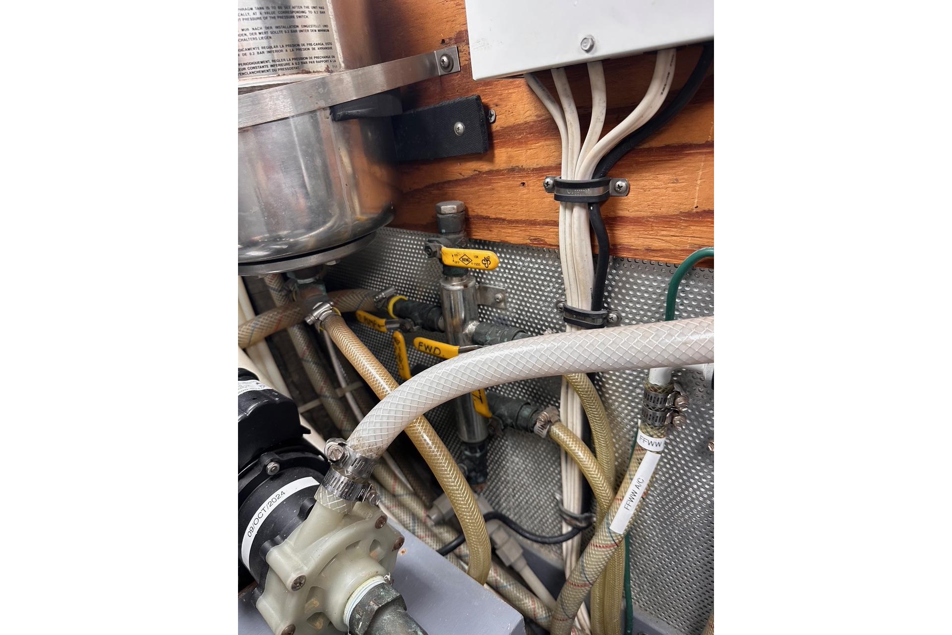 Engine room wiring and hoses in a 1998 Nordhavn 46 boat.