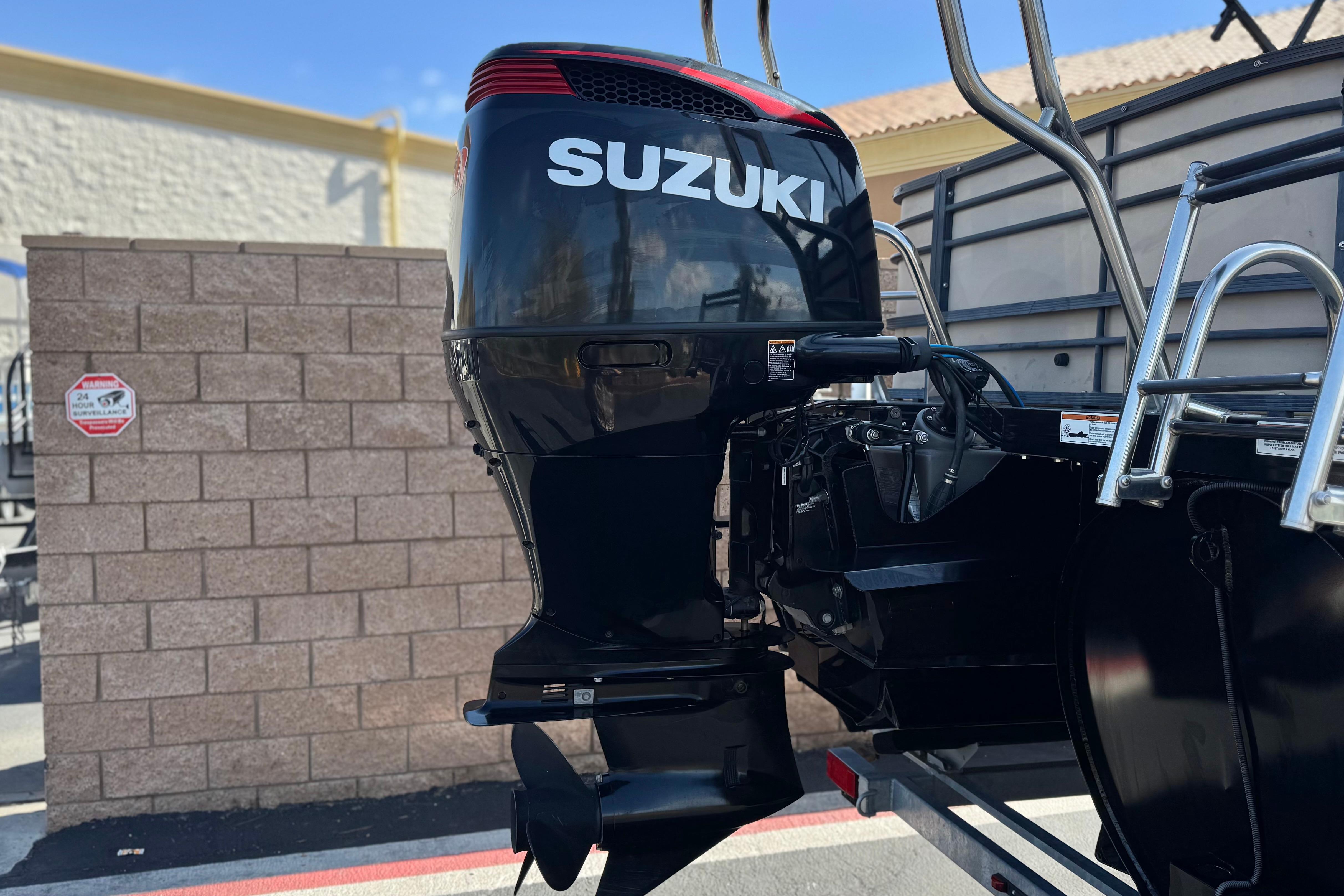 Outboard motor on a 2023 Lexington 623 ST Xtreme boat, featuring Suzuki branding.