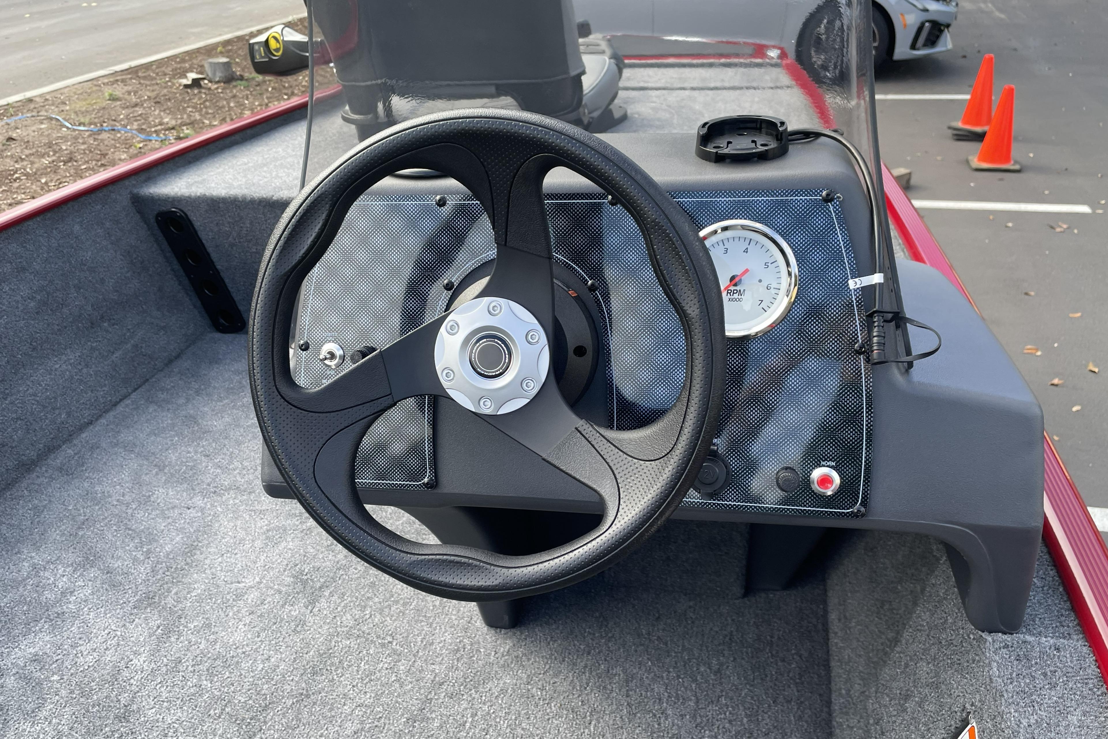 Steering console of 2026 Tracker Bass Tracker Classic XL boat with RPM gauge.