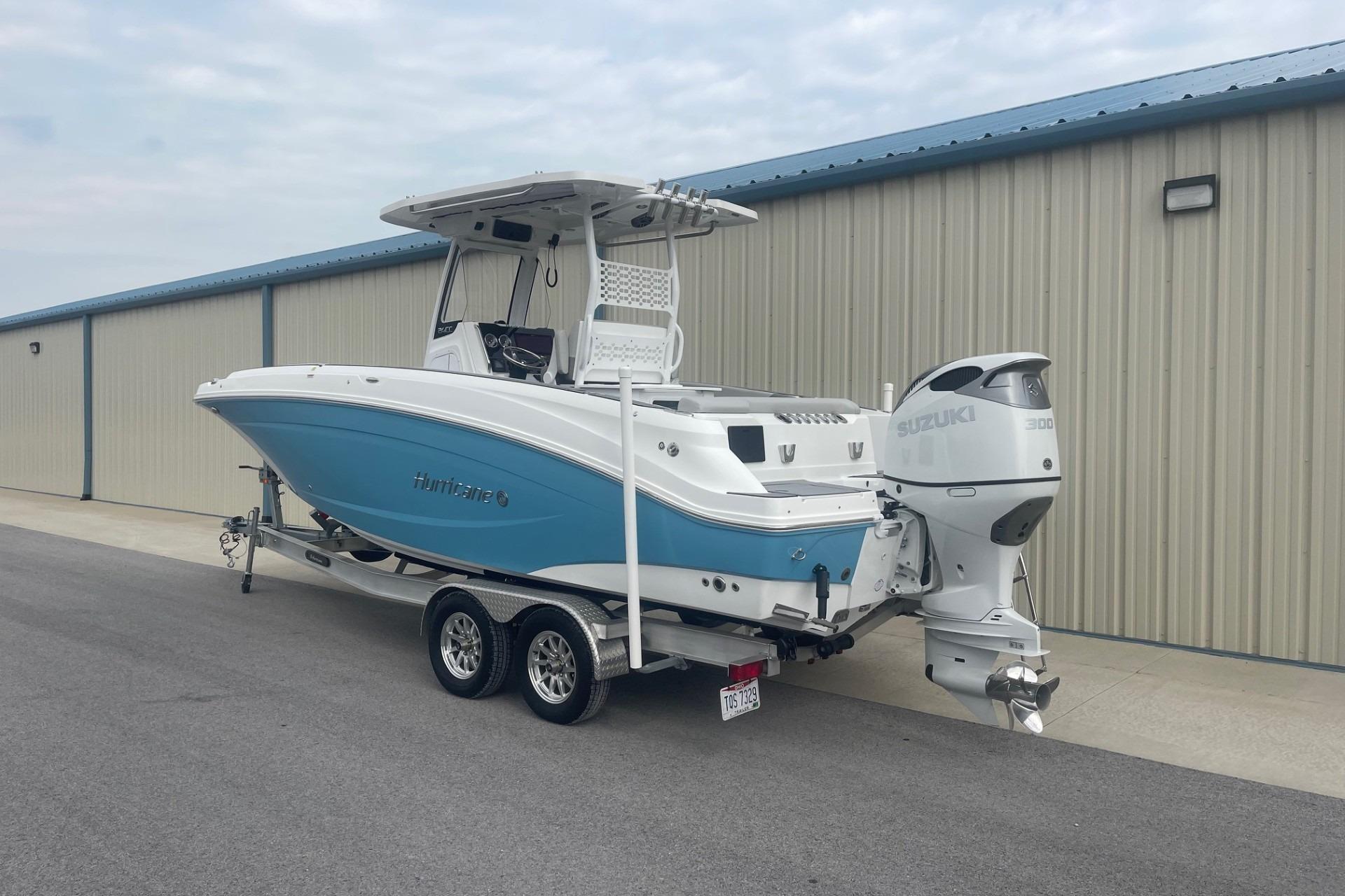 2025 Hurricane Center Console 24 OB boat with Suzuki engine on trailer.