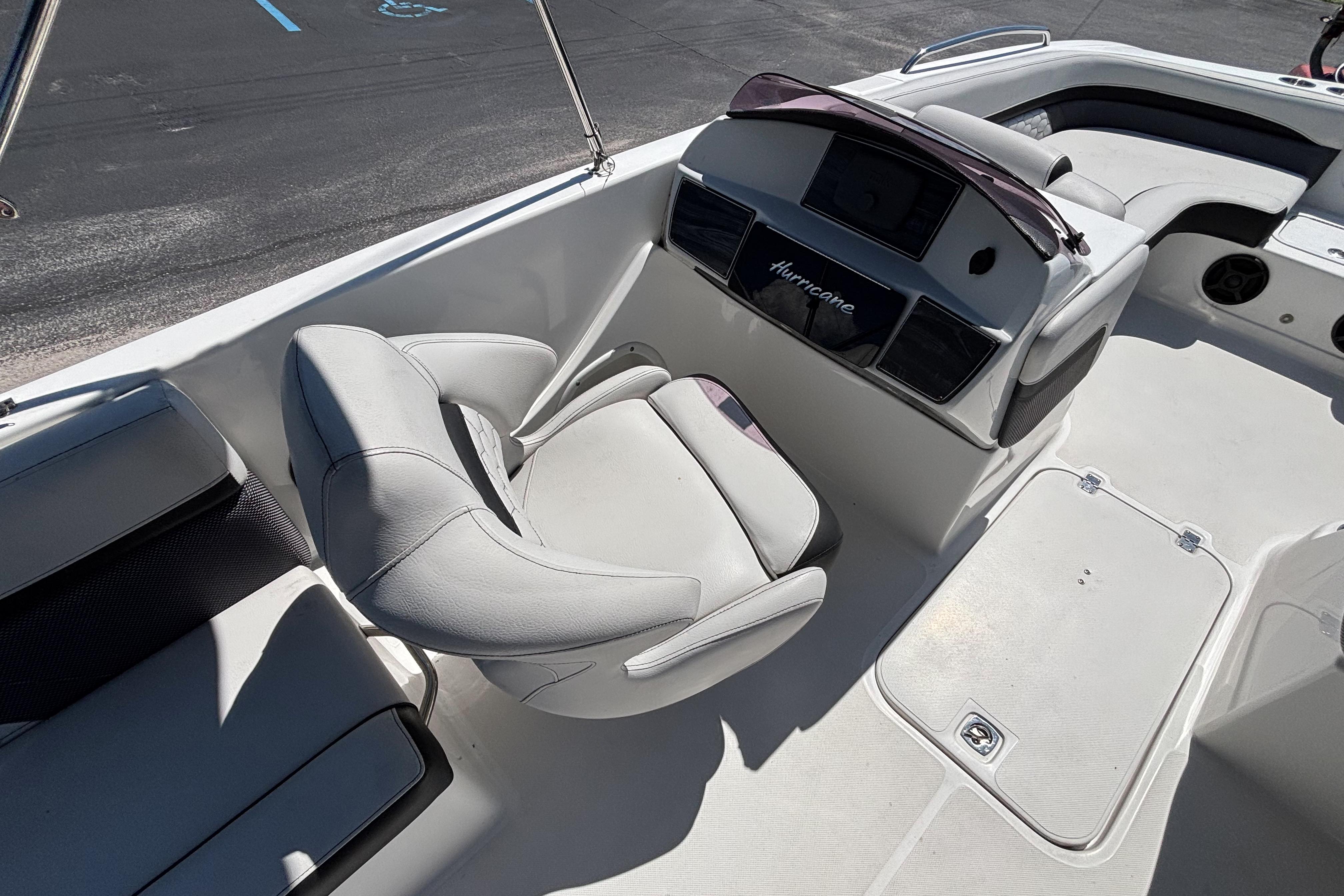 2019 Hurricane Sundeck Sport 218 OB boat interior with seating and console.