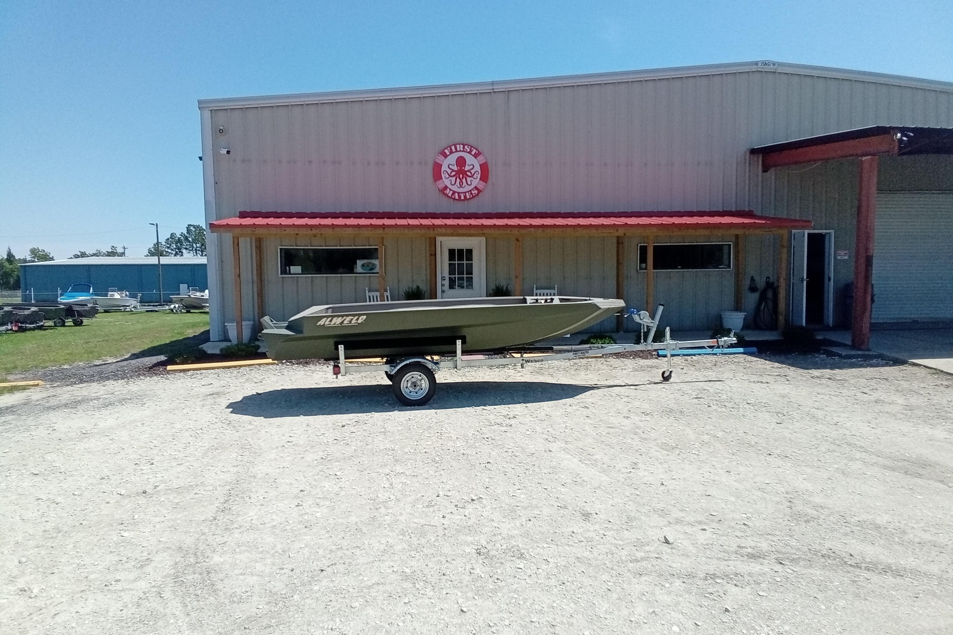 2026 Alweld 1652 Invader boat on trailer outside a warehouse.