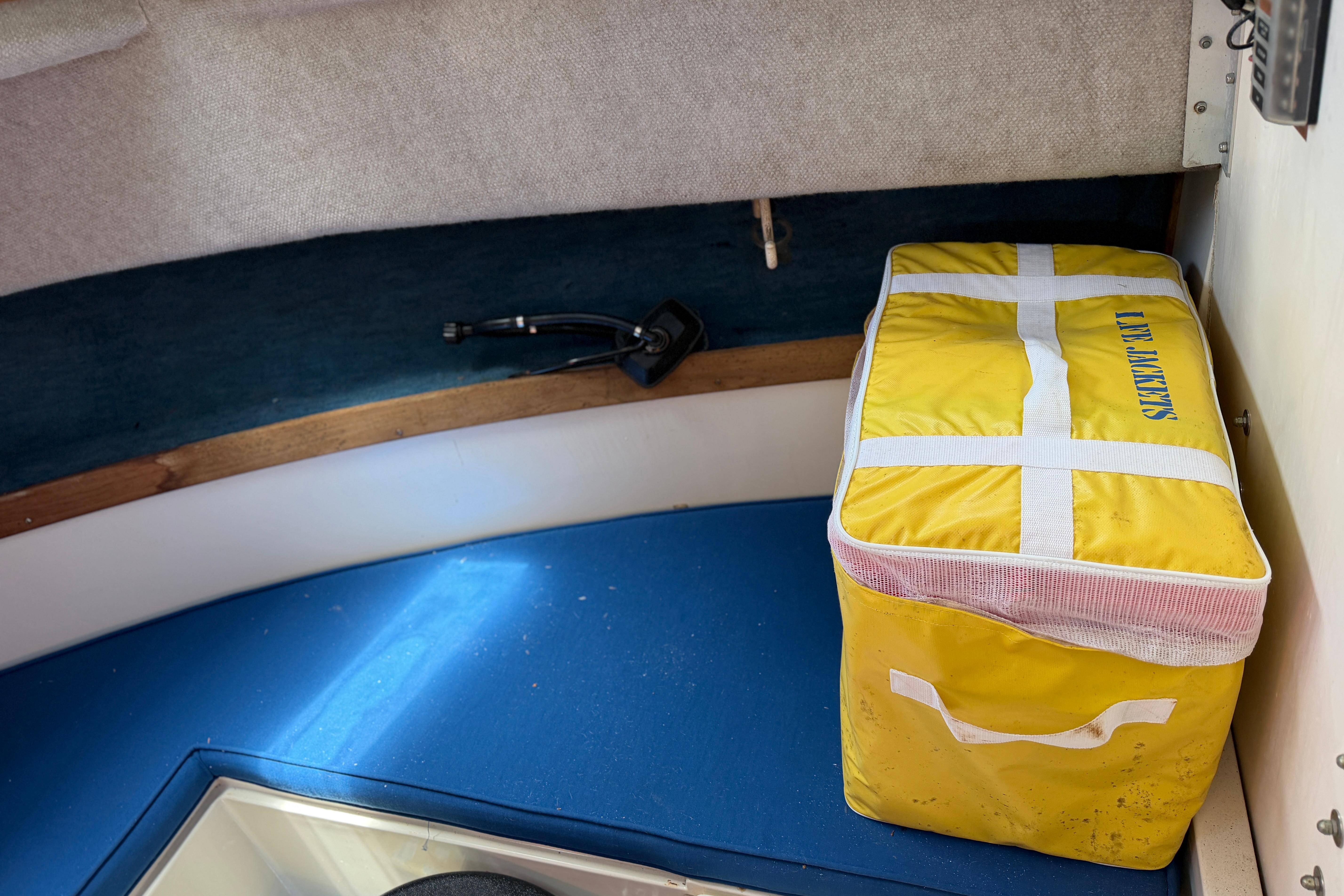 Interior of 1987 Grady-White Seafarer 226 with yellow life jacket bag.