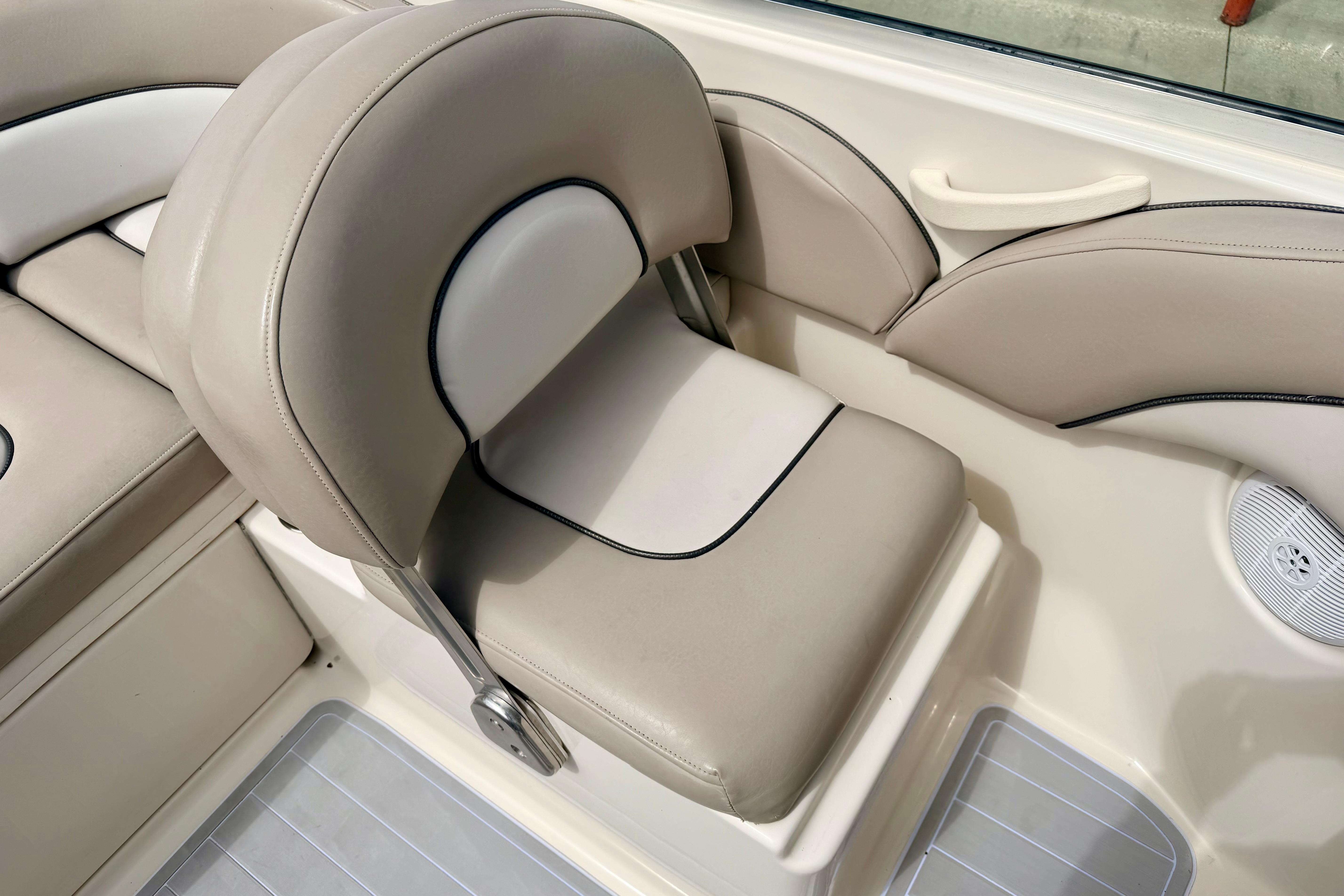 2003 Sea Ray 200 Sundeck boat seat, beige upholstery, sleek design.