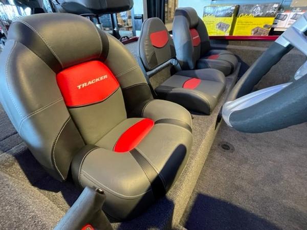 2025 Tracker Savage 215 boat interior with black and red cushioned seats.