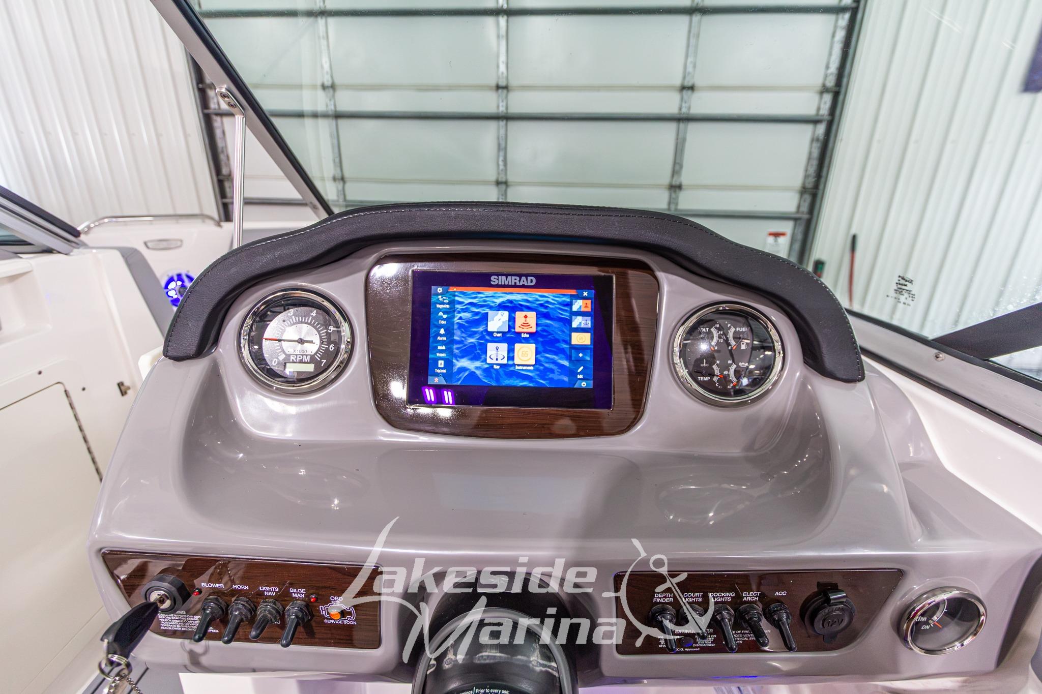 Dashboard of 2022 Chaparral 21 SSi boat with Simrad display and controls.