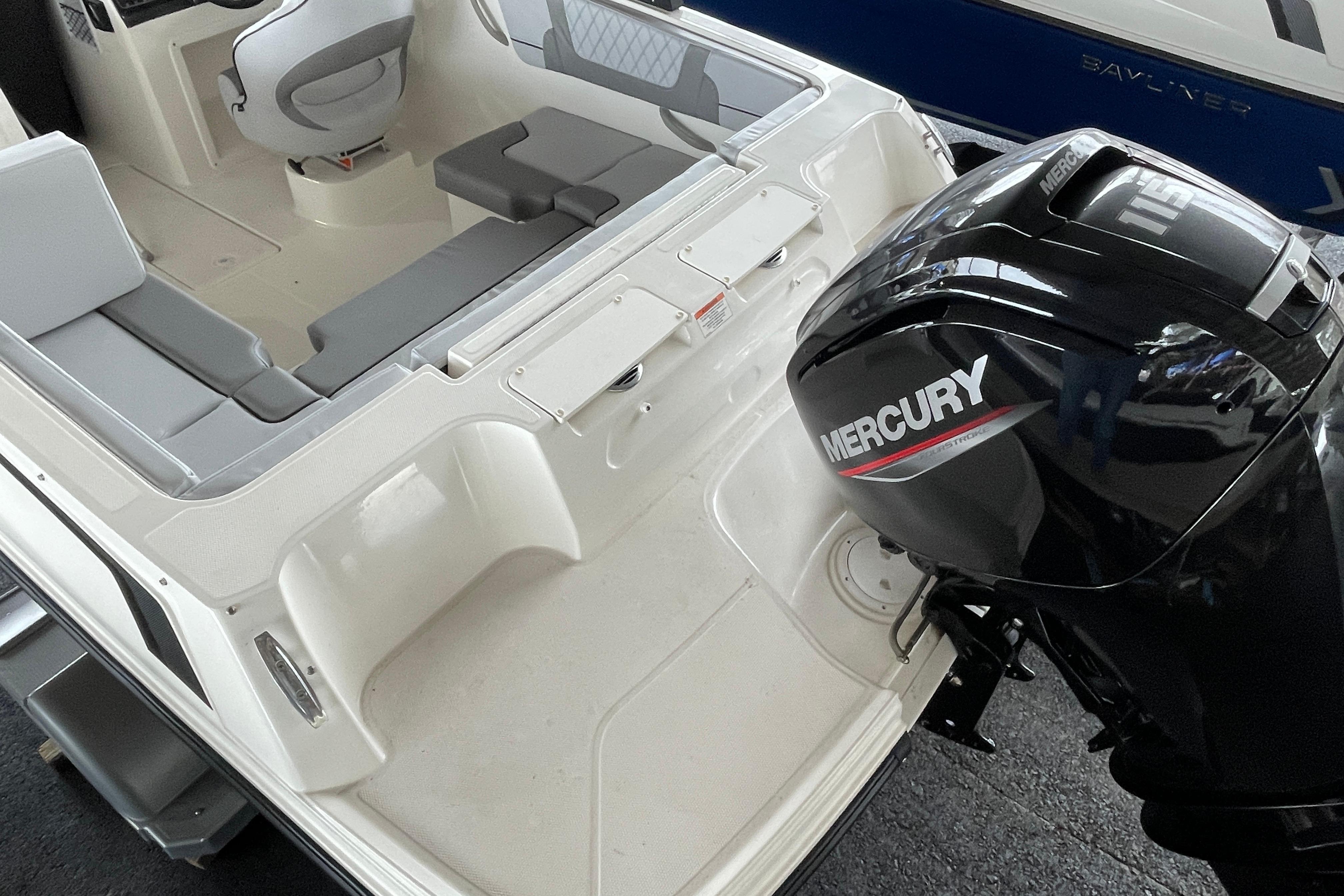 2026 Bayliner VR4 Bowrider OB with Mercury outboard engine, interior seating view.