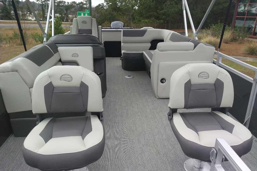 2026 Sun Tracker Fishin' Barge 22 DLX interior with comfortable seating and spacious layout.