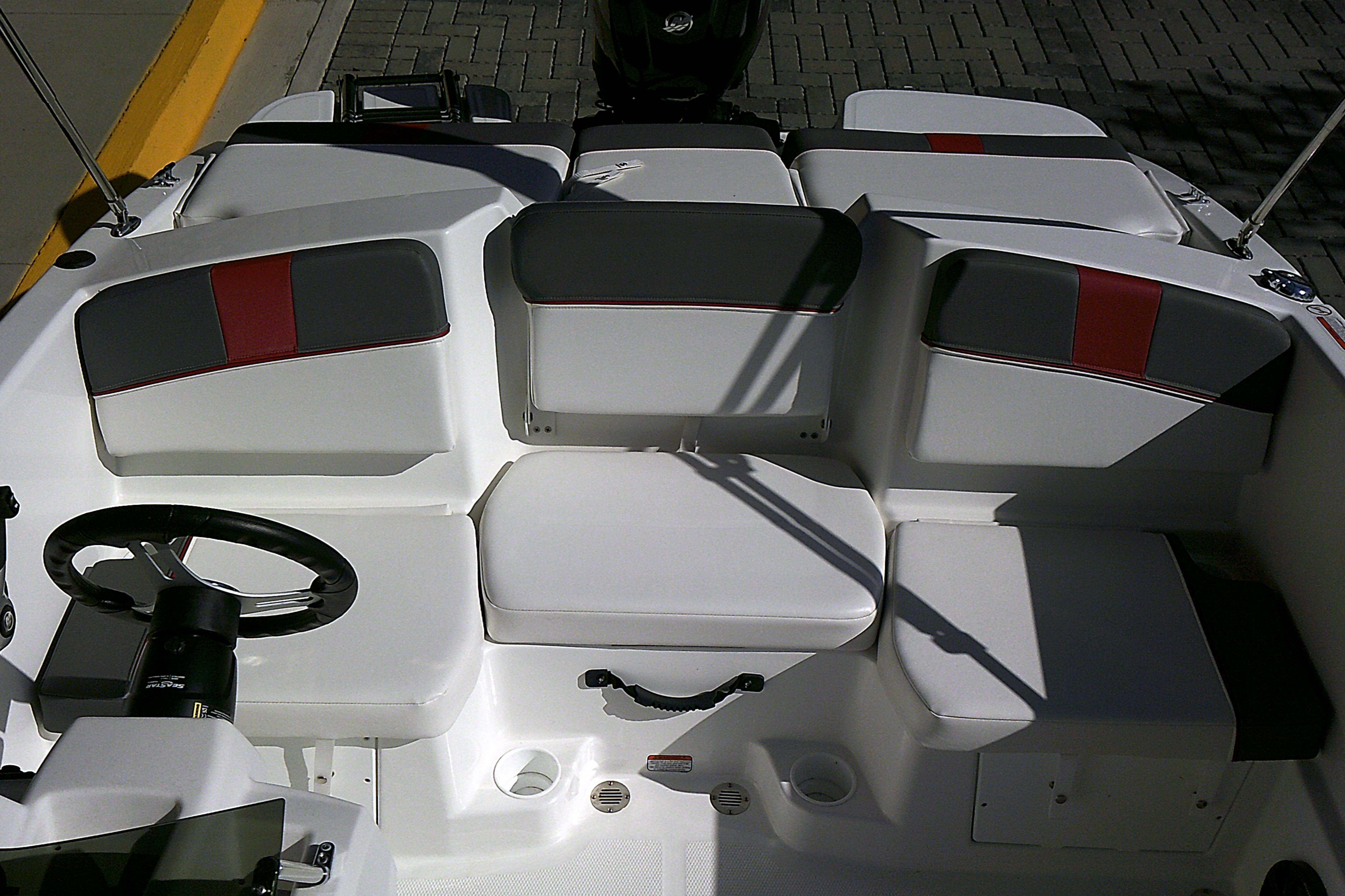 Interior of 2025 Tahoe T16 boat with white and gray seating.