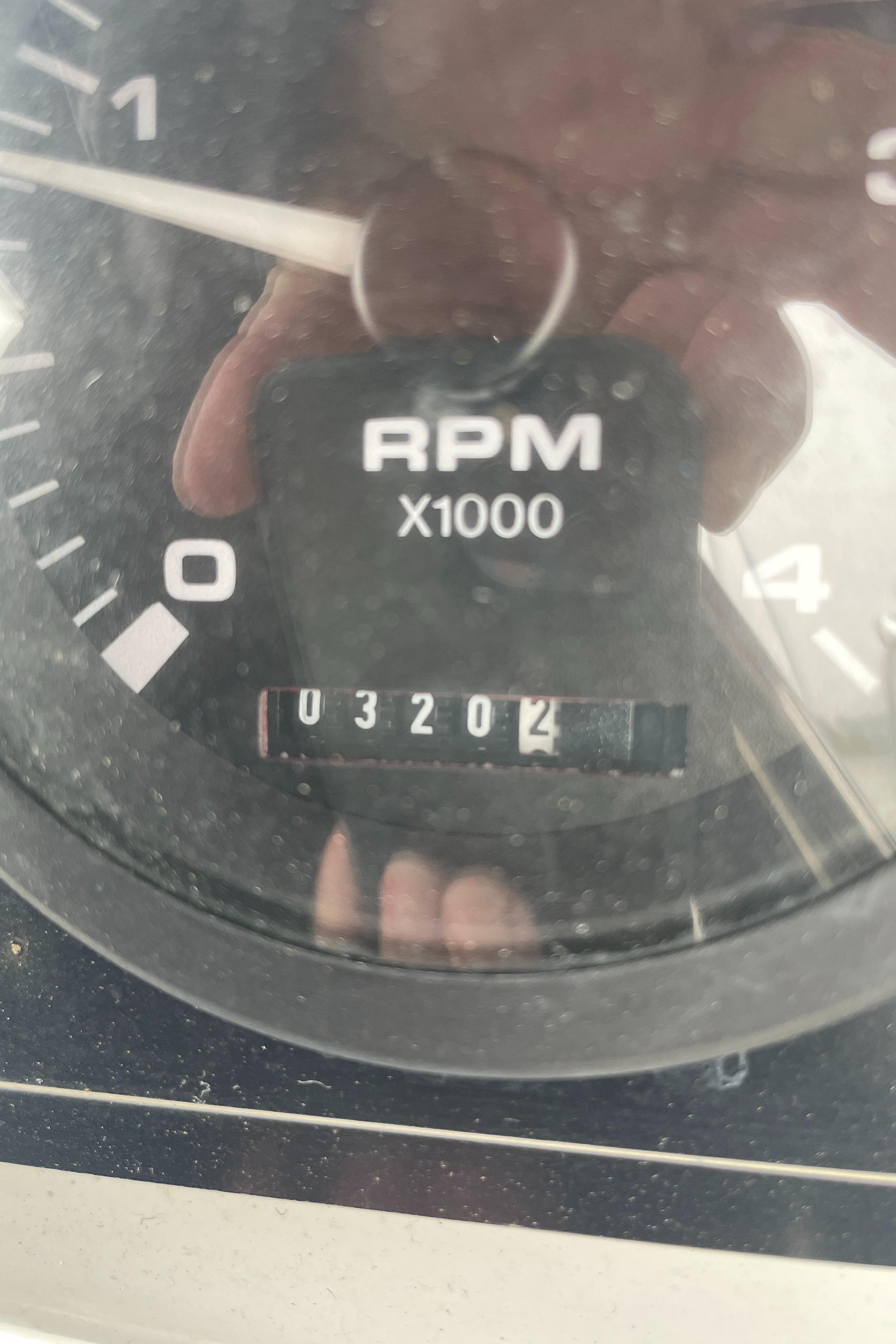 Close-up of Catalina 309 tachometer showing 3,204 RPM, model year 2008.