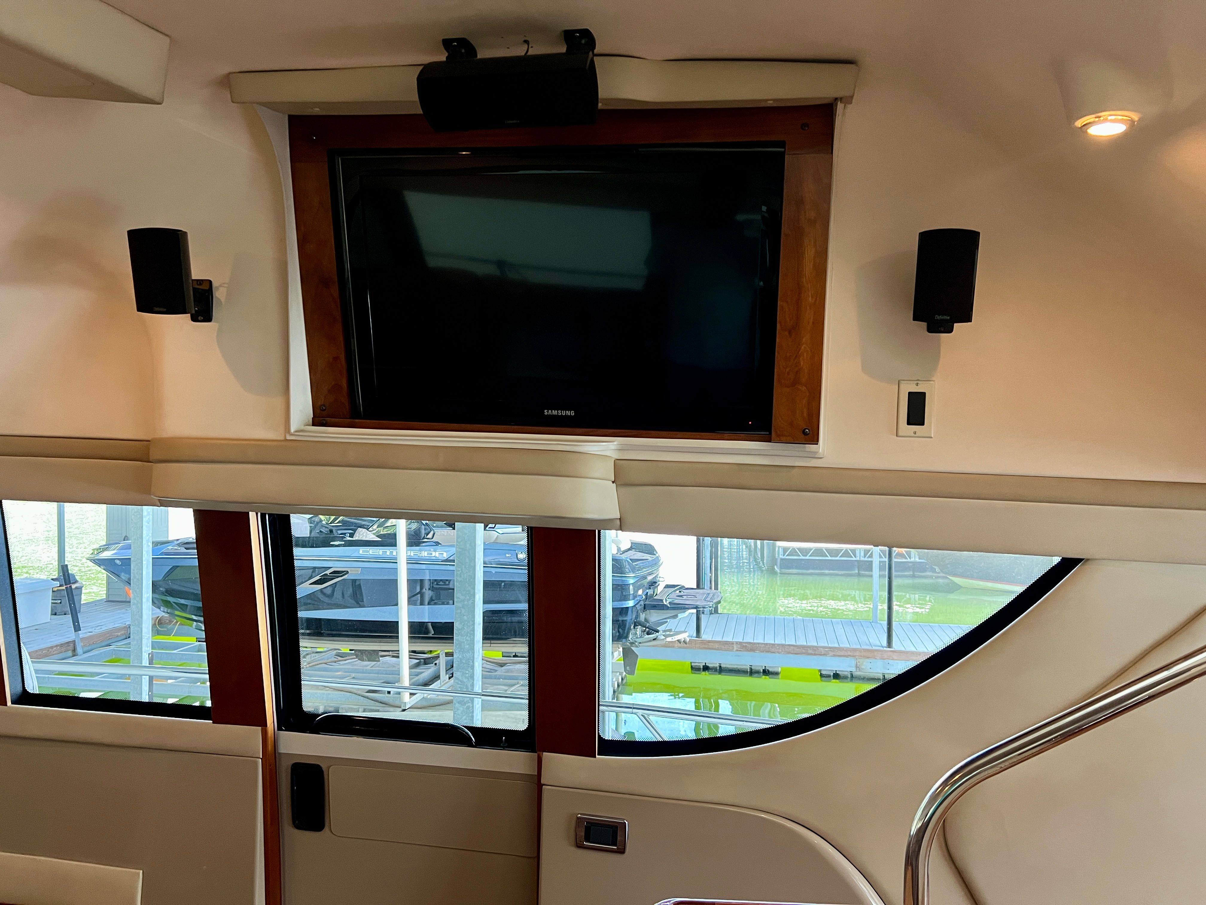 Interior of Carver 560 Voyager Sky yacht with TV and speakers.