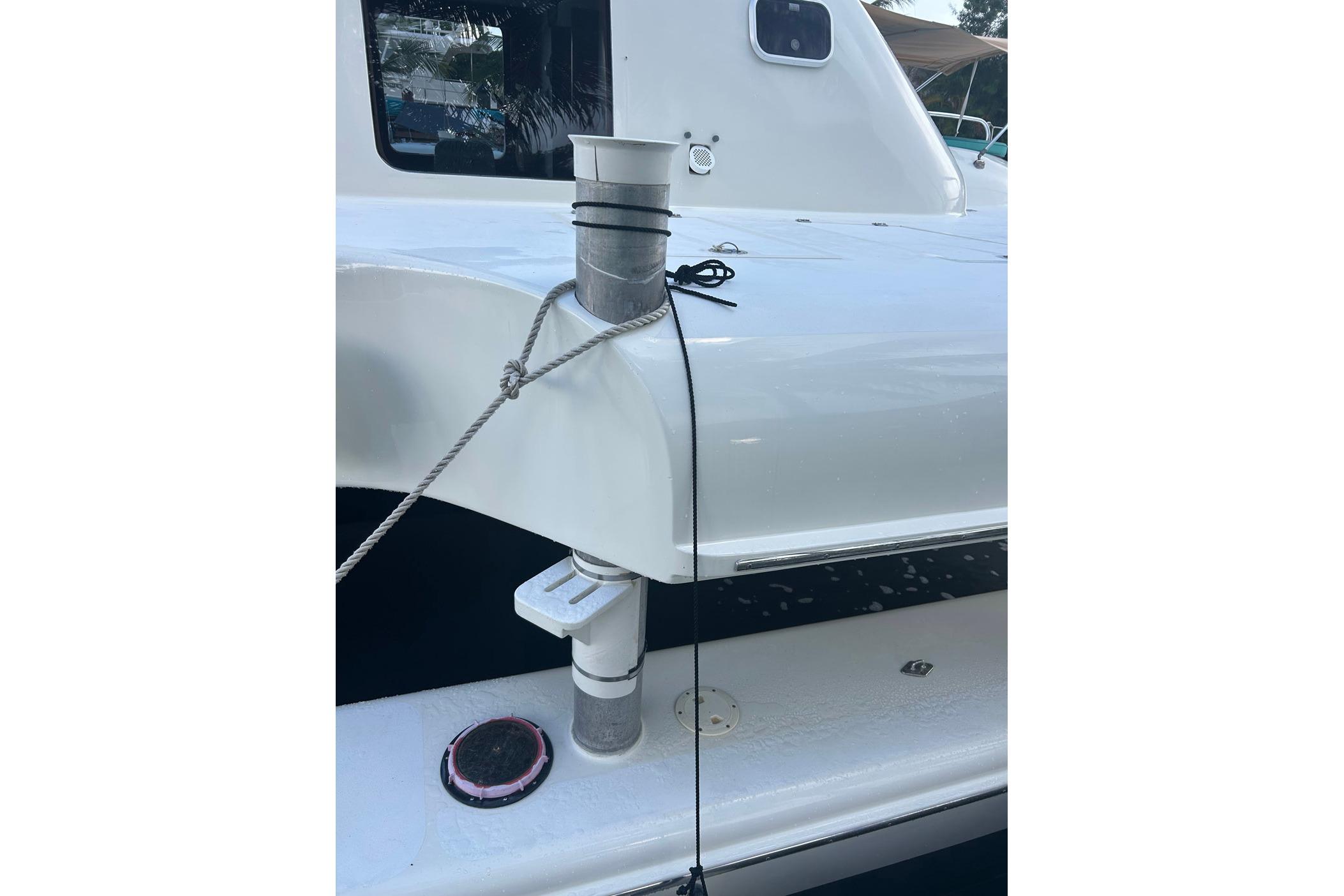 White 2002 Custom 64 Stuart Catamarans deck with rope and fittings.