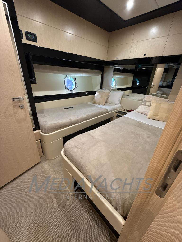 Luxurious bedroom interior of 2007 Riva Venere 75 yacht with twin beds and modern design.