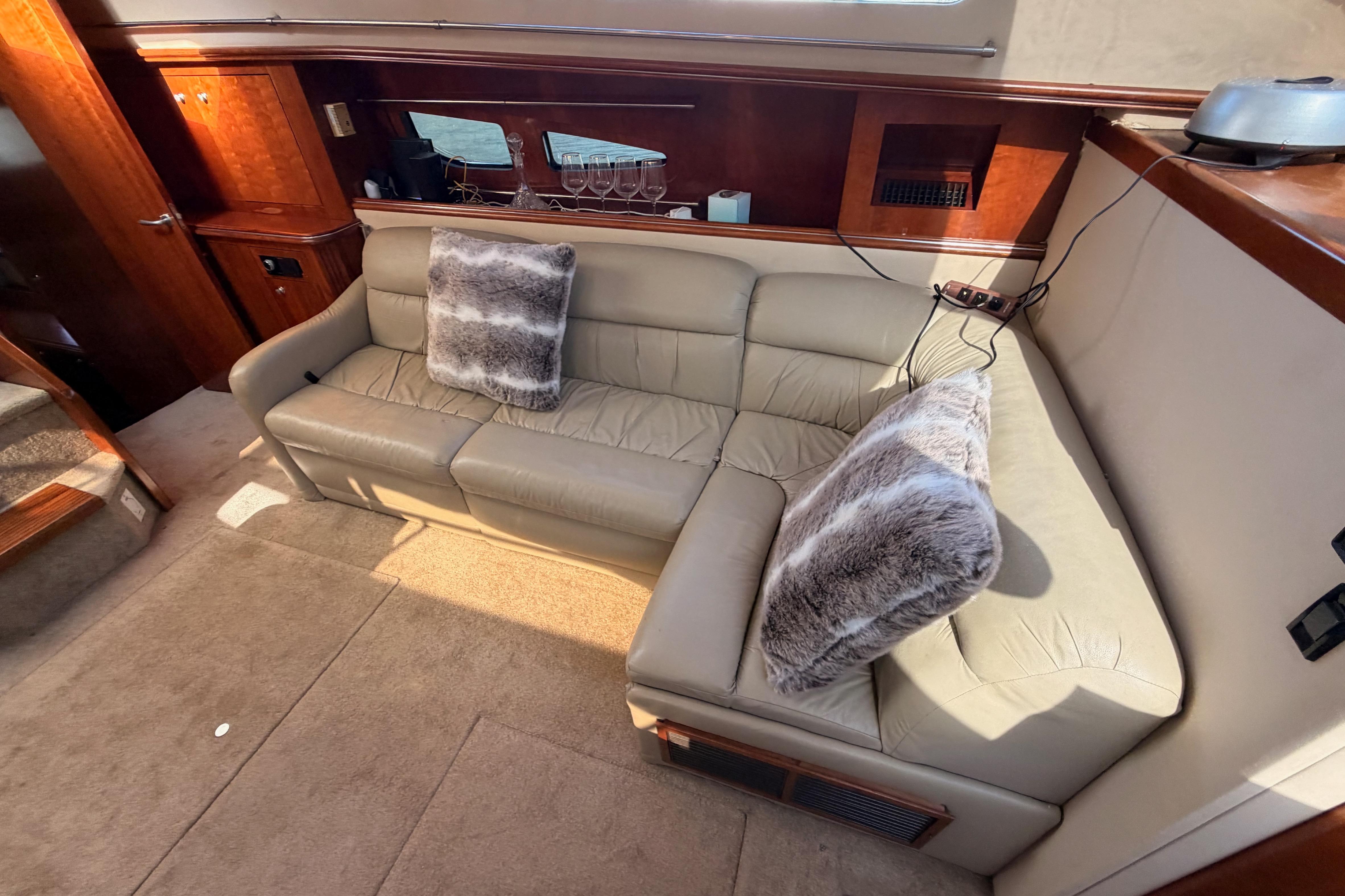 Luxurious interior of 2005 Cruisers Yachts 405 Express Motoryacht with plush seating and decor.