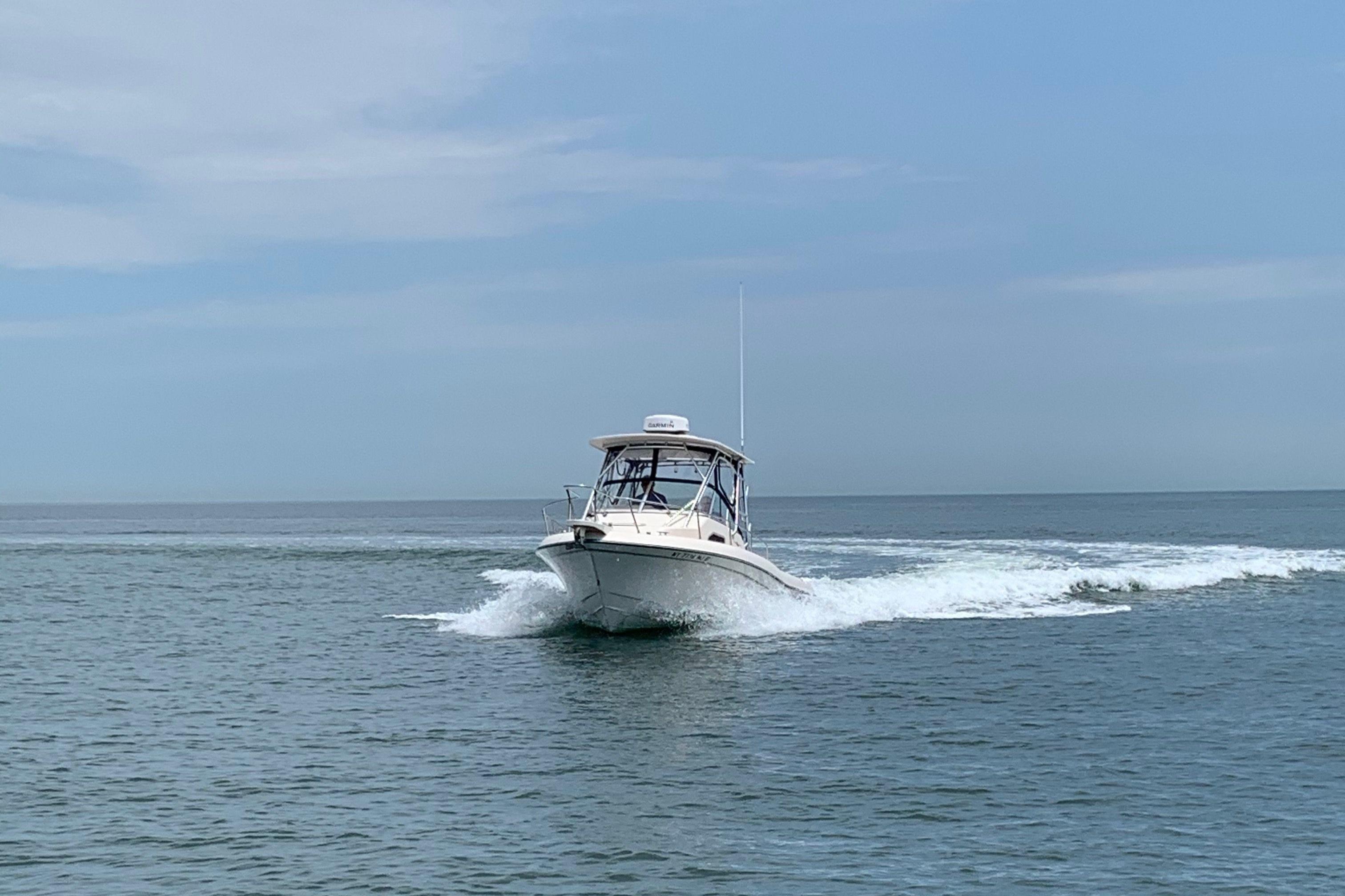 2014 Grady-White Gulfstream 232 boat cruising on open water.