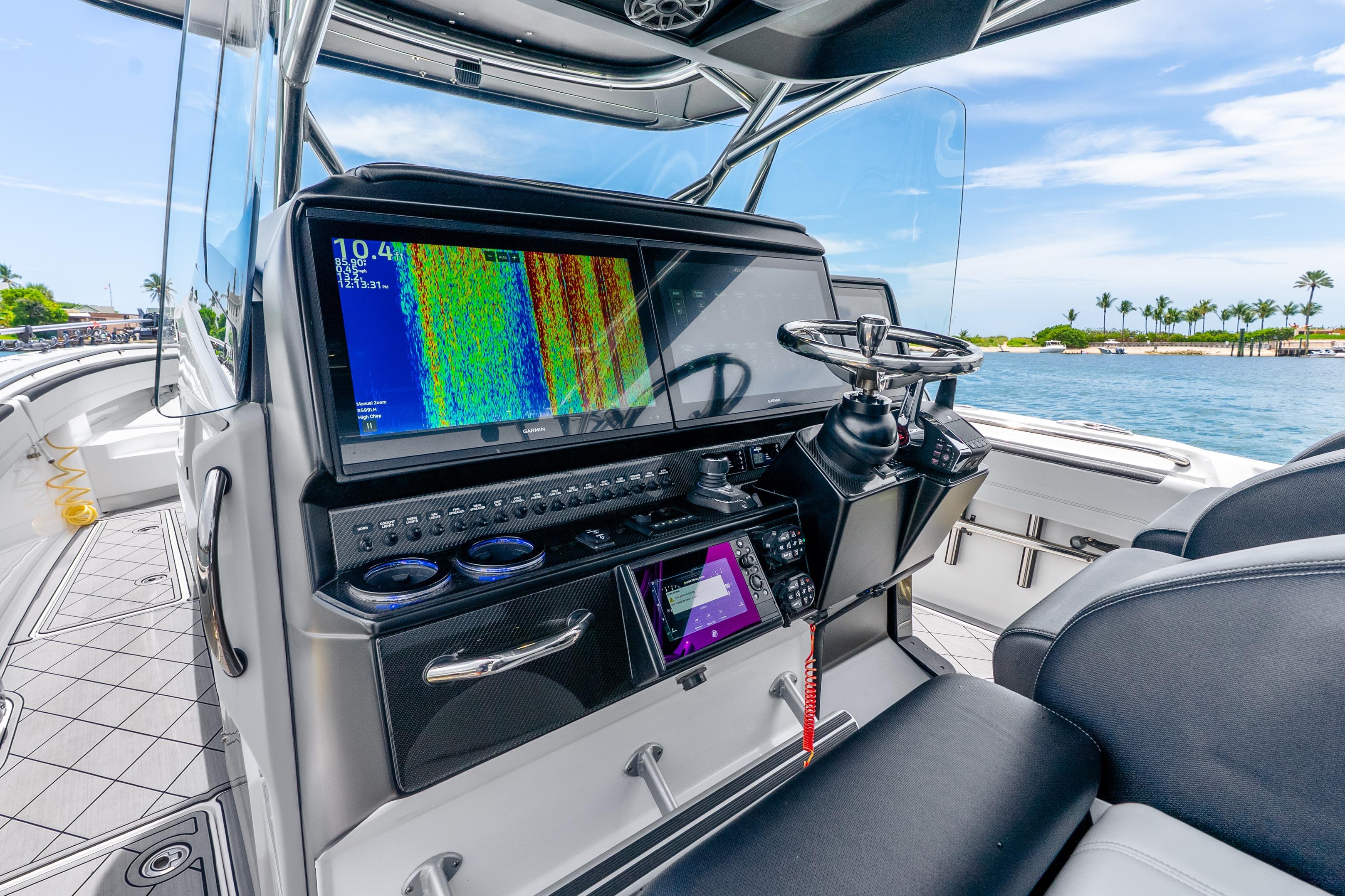 2024 Nor-Tech 452 Super Fish boat dashboard with advanced navigation system and steering wheel.