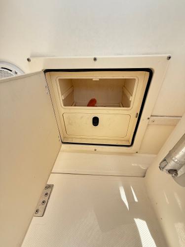 2001 Albemarle 280 Express Sport Fisherman storage compartment with open hatch.