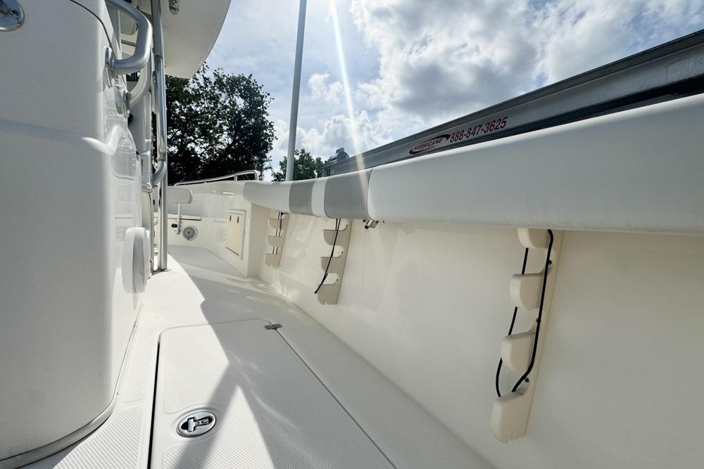 2018 Mako 284 Center Console boat interior with sleek white design and sunny sky.