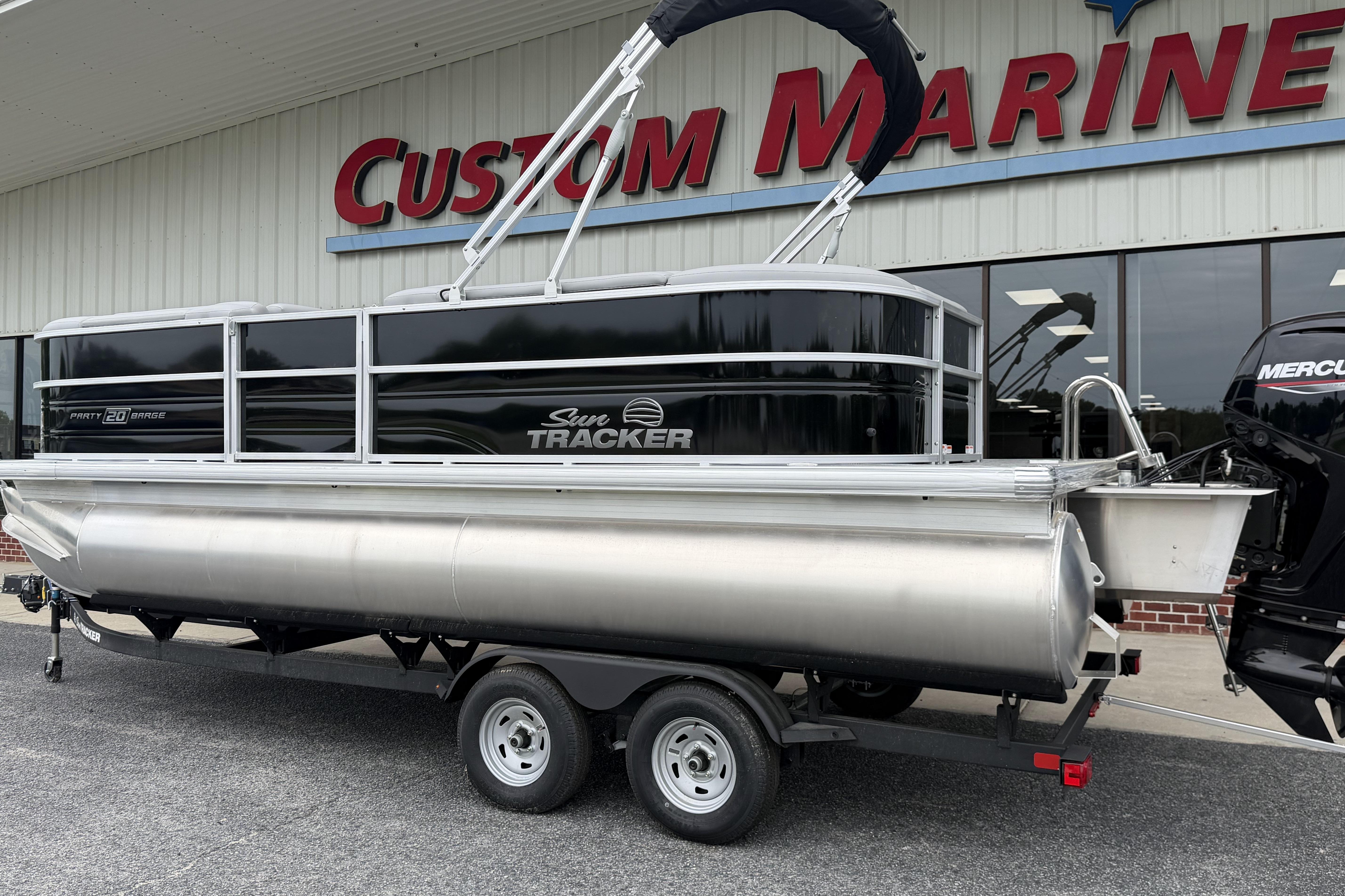 2026 Sun Tracker Party Barge 20 DLX pontoon boat at Custom Marine dealership.