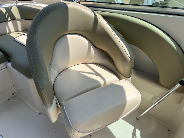2005 Sea Ray 220 Sundeck boat interior with beige and green seating.