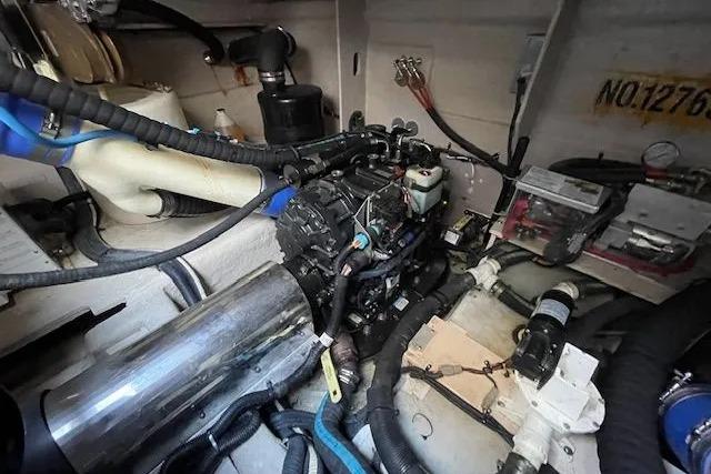 Engine room of a 2016 Sea Ray Sundancer 510 yacht, showcasing mechanical components and wiring.
