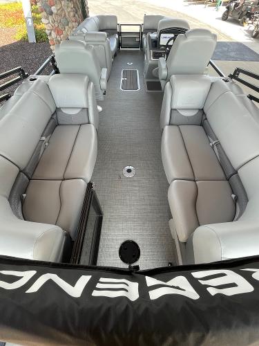 2024 Regency 230 DL3 pontoon boat interior with plush seating and modern design.