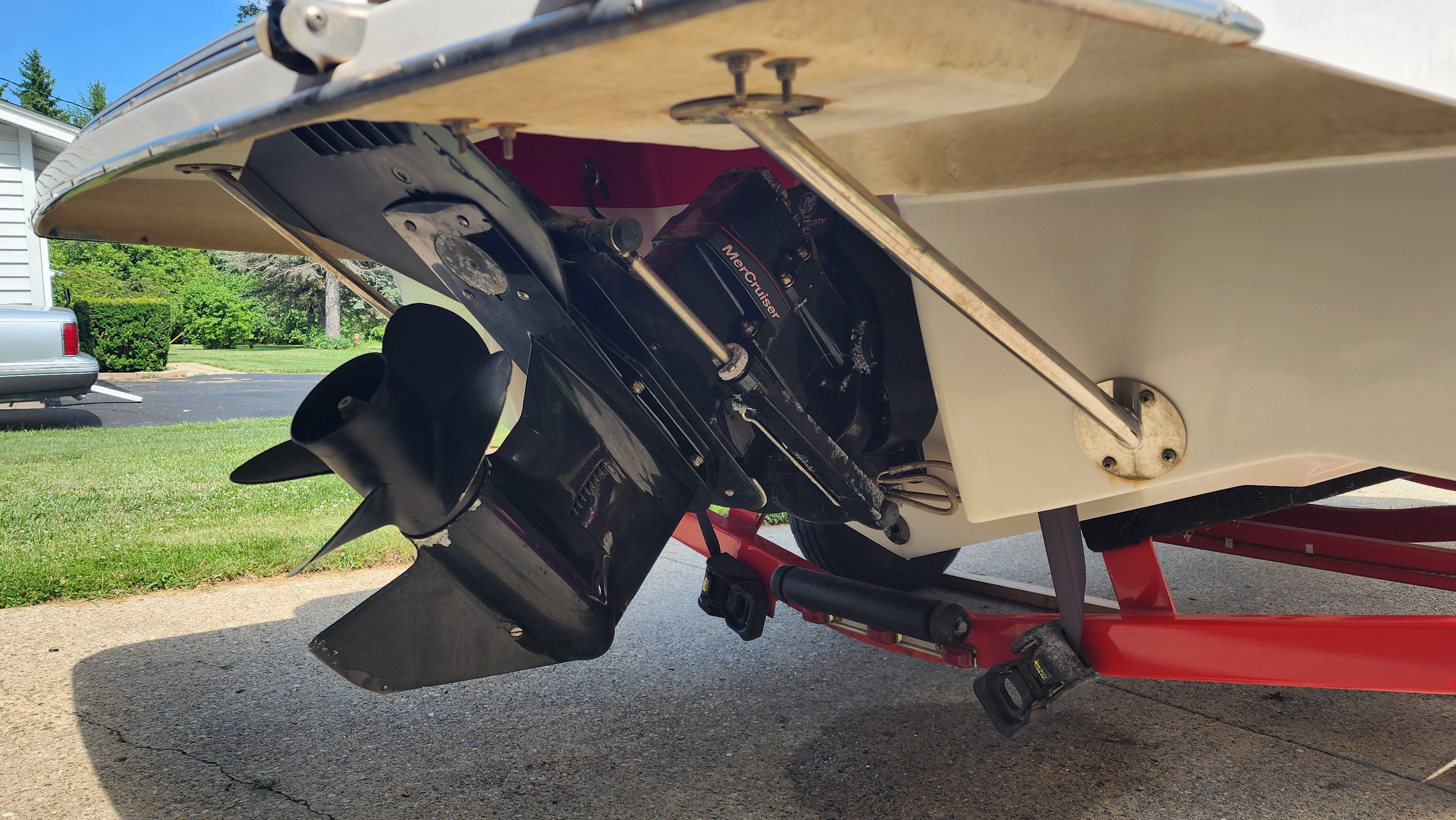 Close-up of a 2015 Four Winns H190 boat's drive on a trailer.