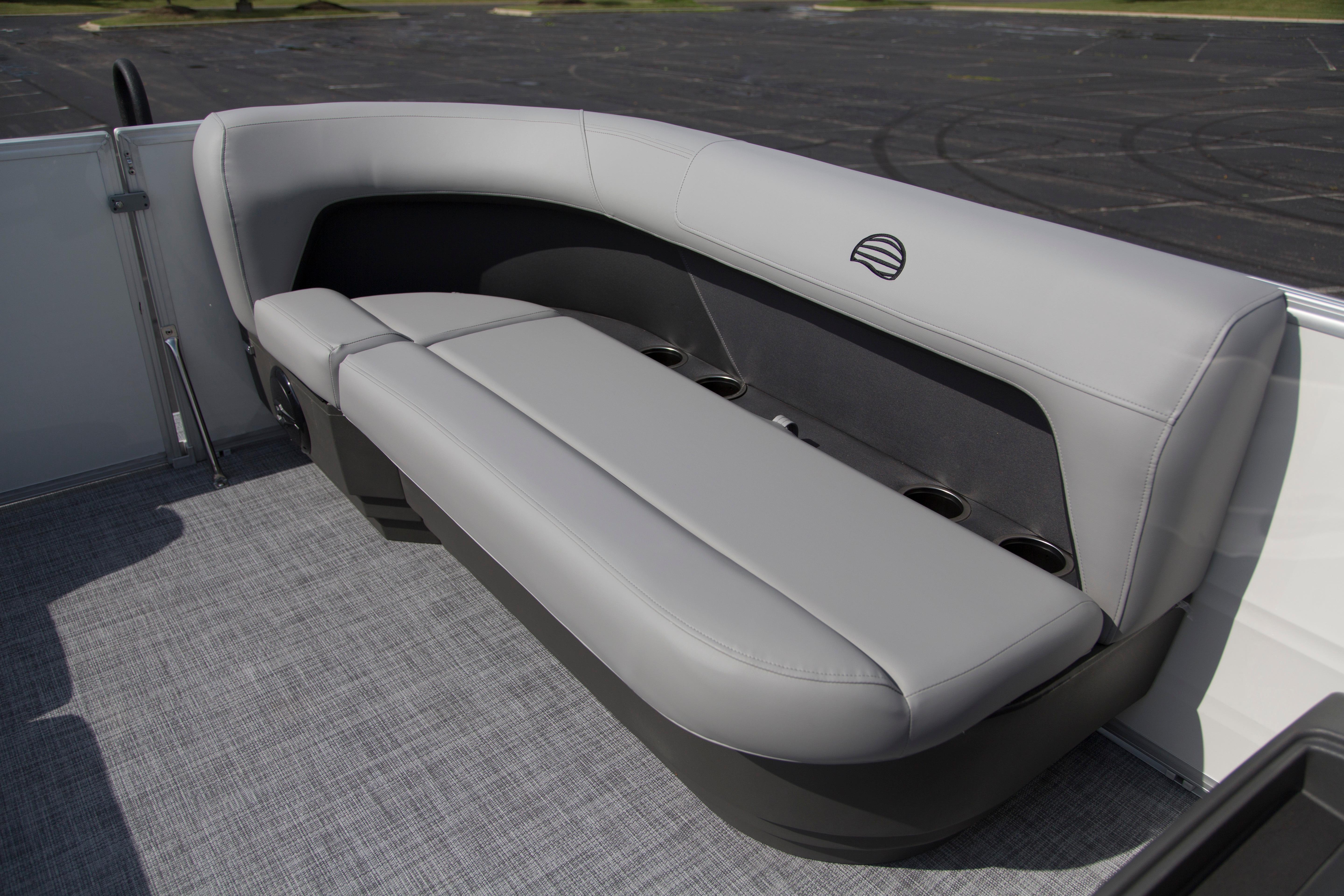 2026 Sun Tracker Party Barge 16 DLX, featuring sleek gray seating and cup holders.