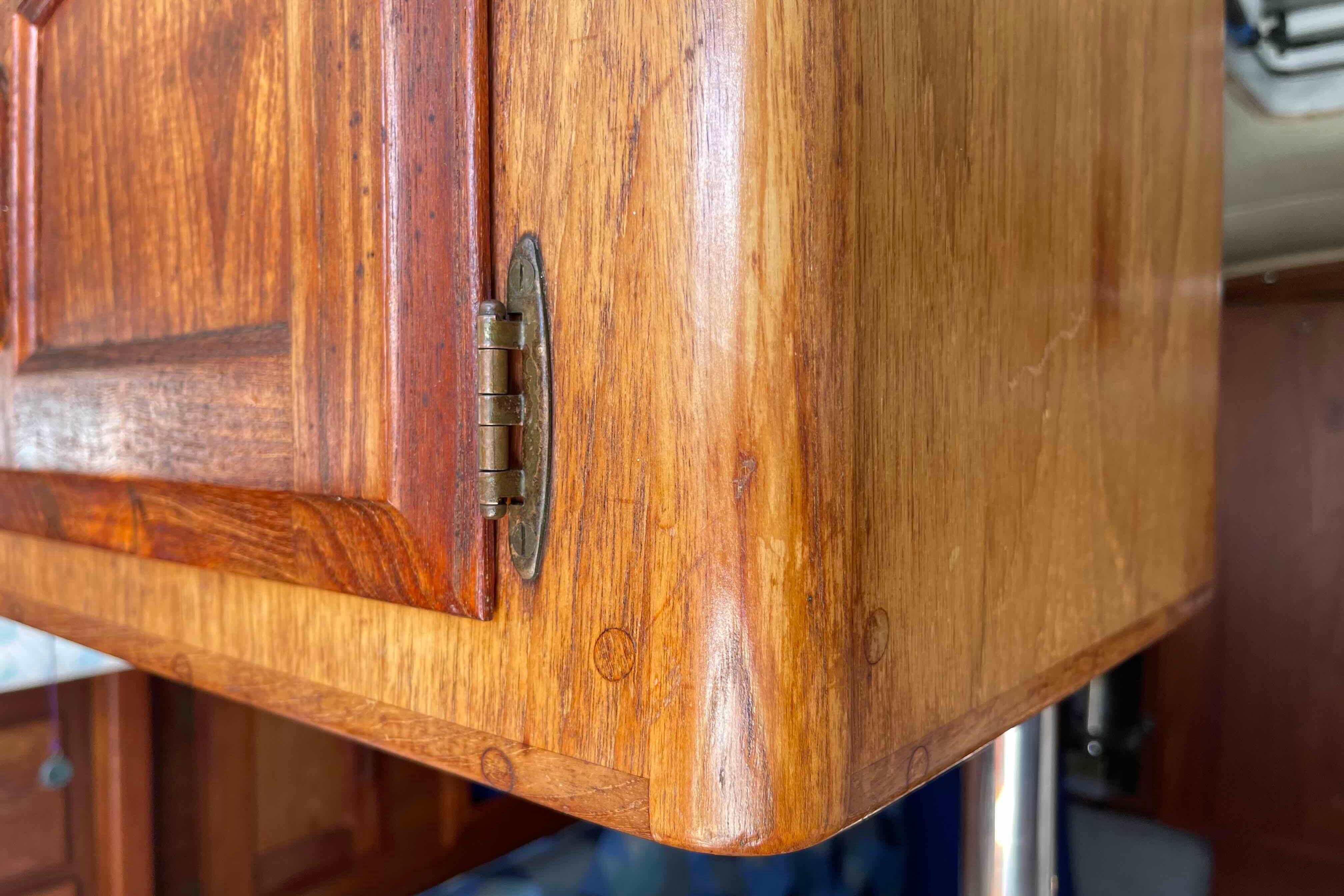 Wooden cabinet detail on 1987 Pacific Seacraft 34 sailboat, showcasing craftsmanship and design.