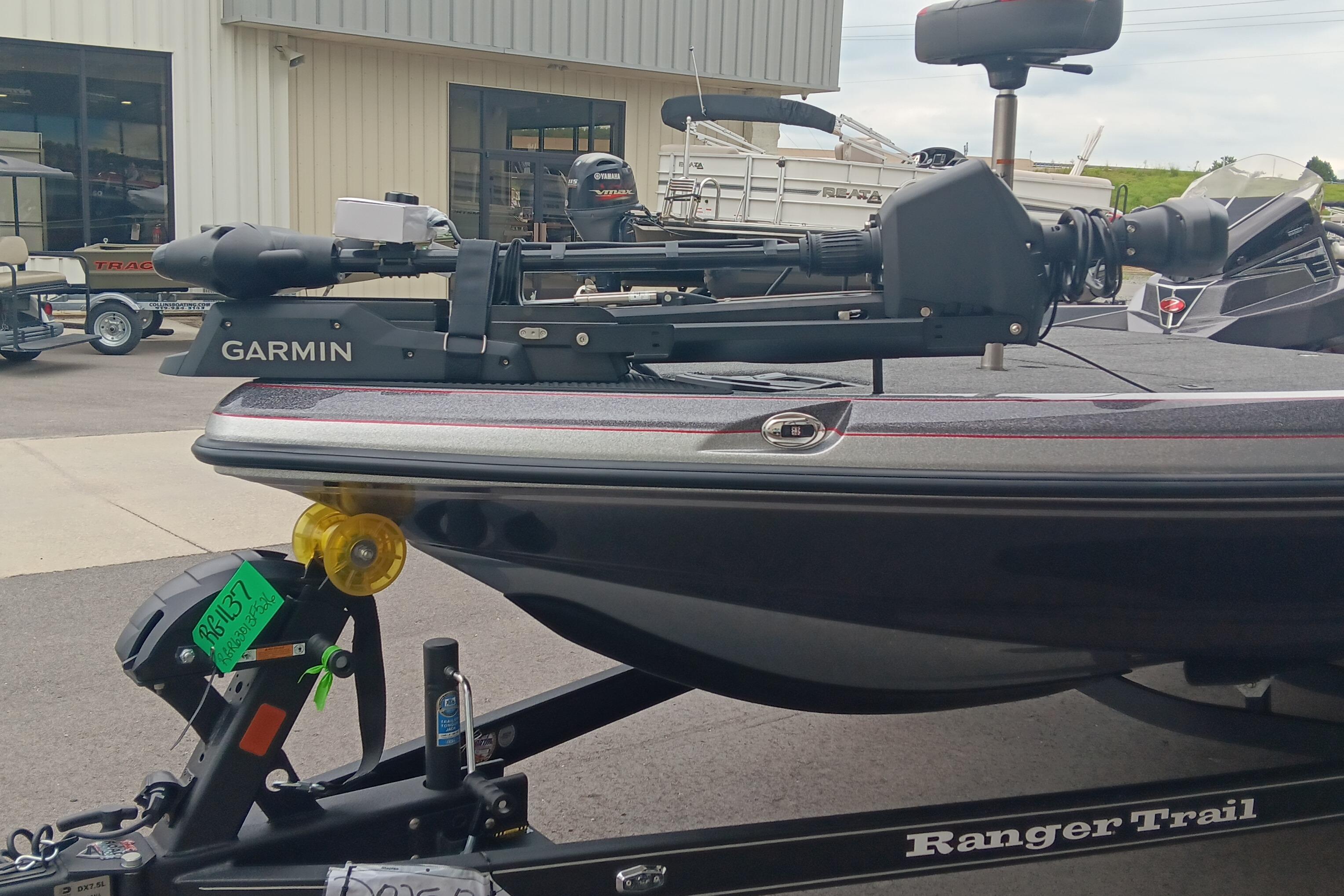 2026 Ranger Z520 boat with Garmin equipment on trailer, parked outside dealership.